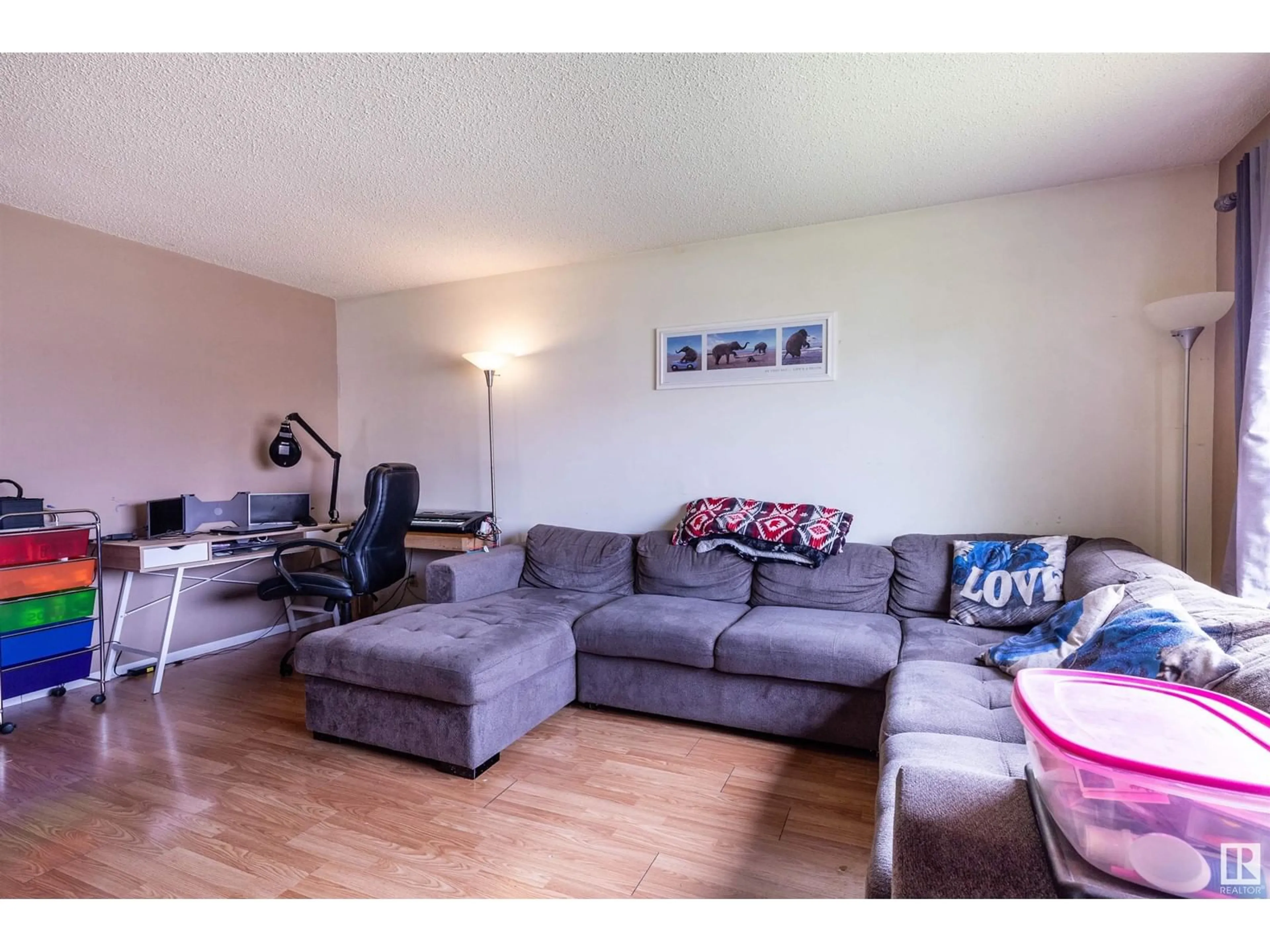 Living room with furniture, wood/laminate floor for 16115 100A AV, Edmonton Alberta T5P0L9