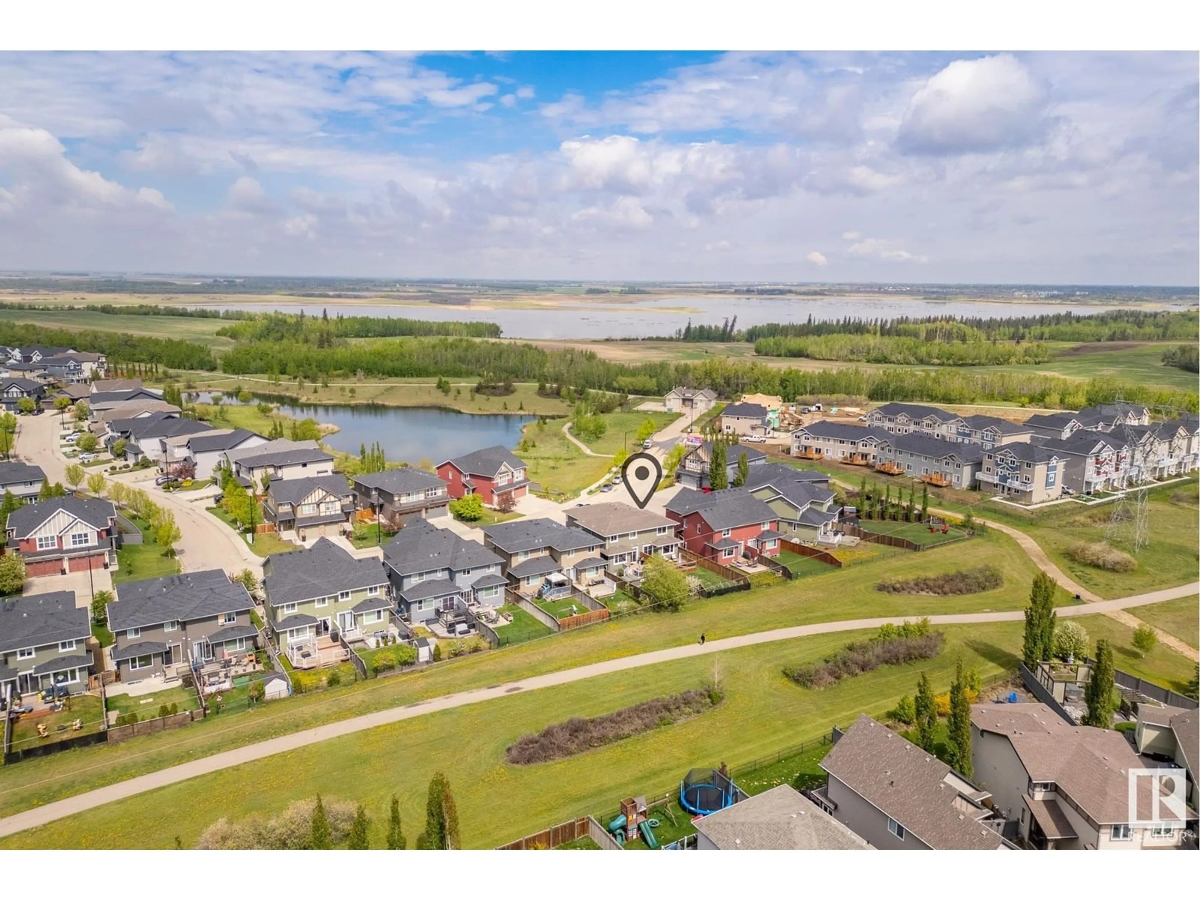 A pic from outside/outdoor area/front of a property/back of a property/a pic from drone, water/lake/river/ocean view for NW - 13117 205 ST, Edmonton Alberta T5S0J2