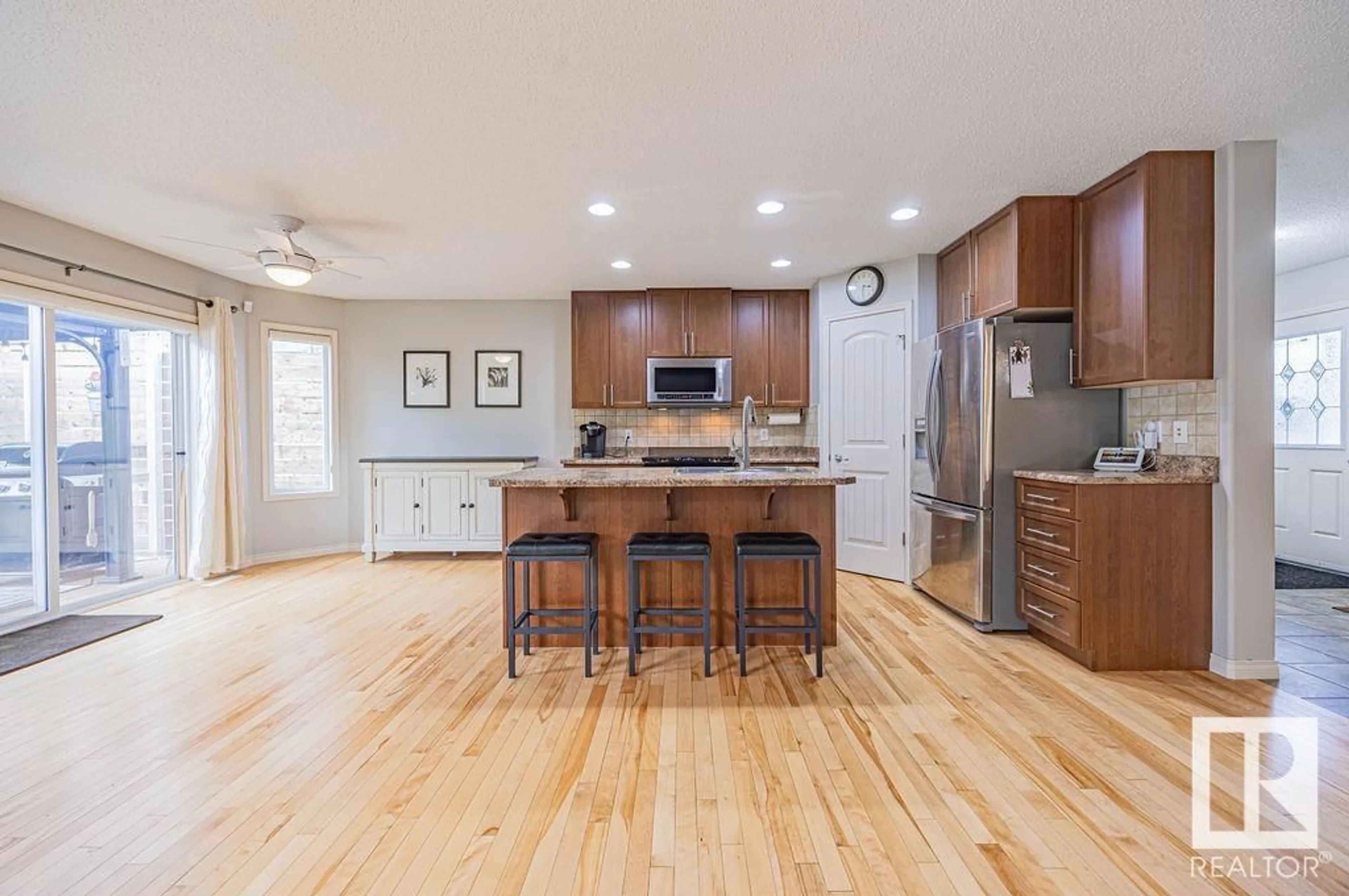 Open concept kitchen, wood/laminate floor for 21 ASHTON GA, Spruce Grove Alberta T7X0H9