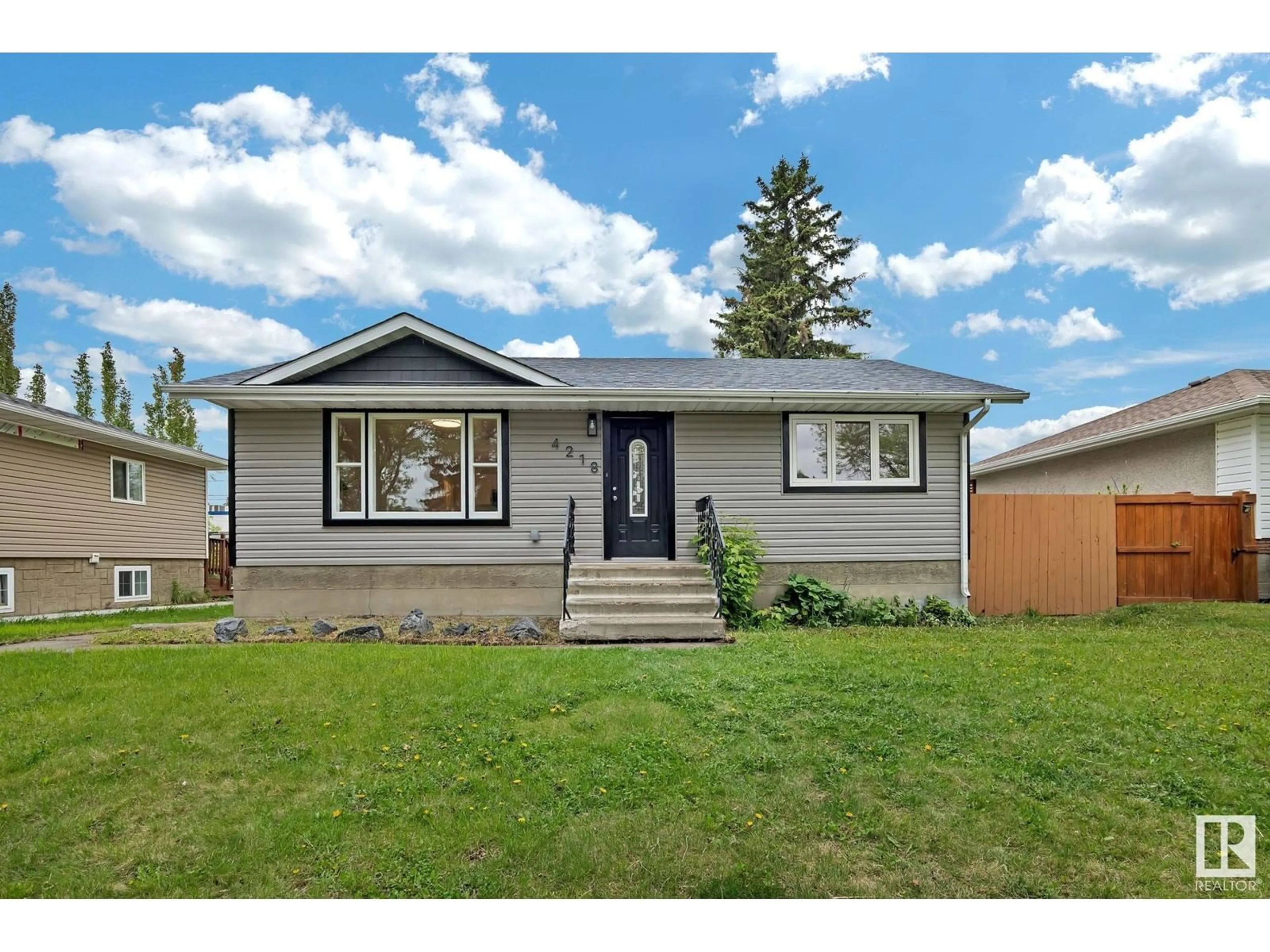 Home with vinyl exterior material, street for NW - 4218 117 AV, Edmonton Alberta T5W0Y4