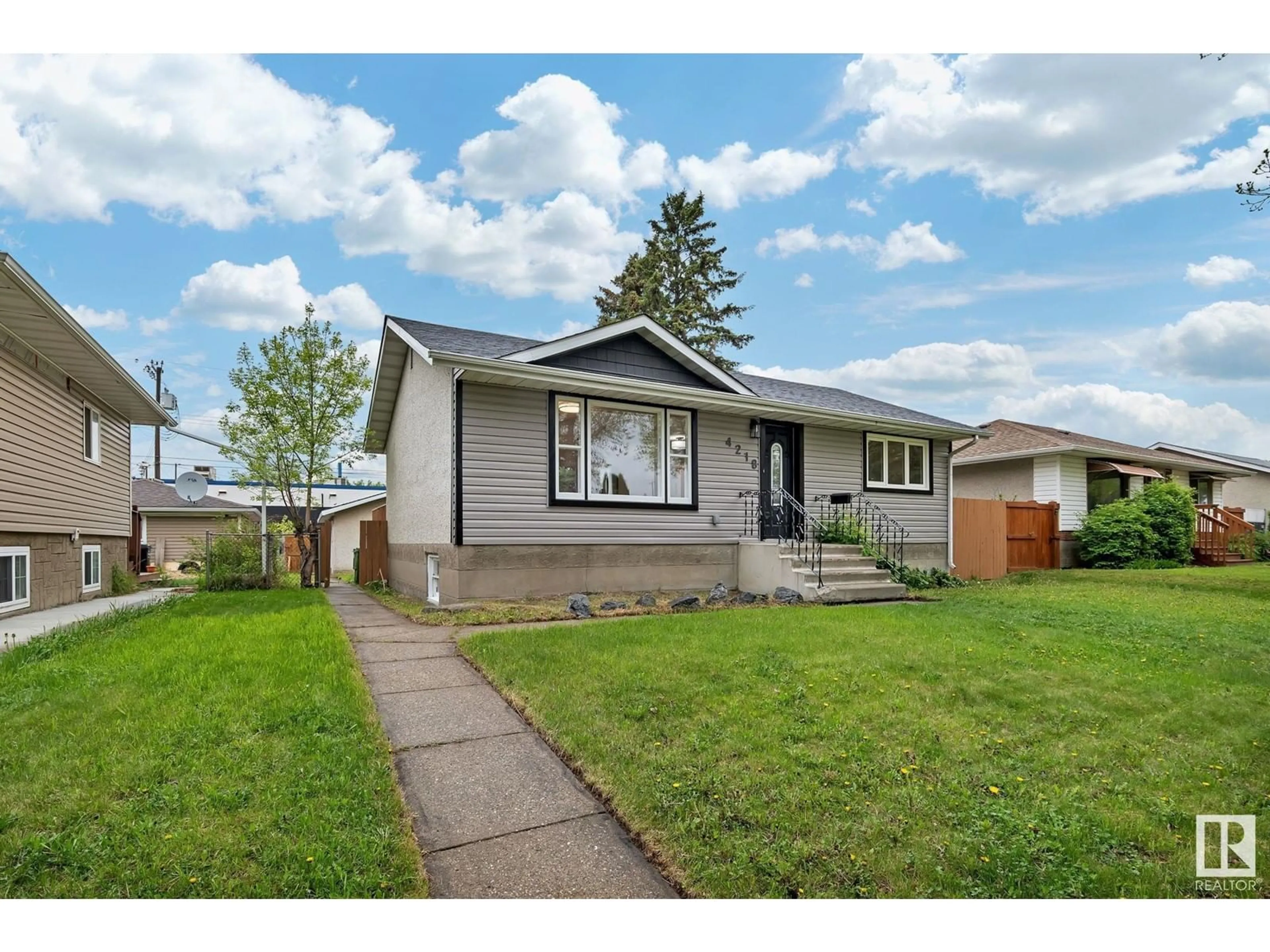 Home with vinyl exterior material, street for NW - 4218 117 AV, Edmonton Alberta T5W0Y4