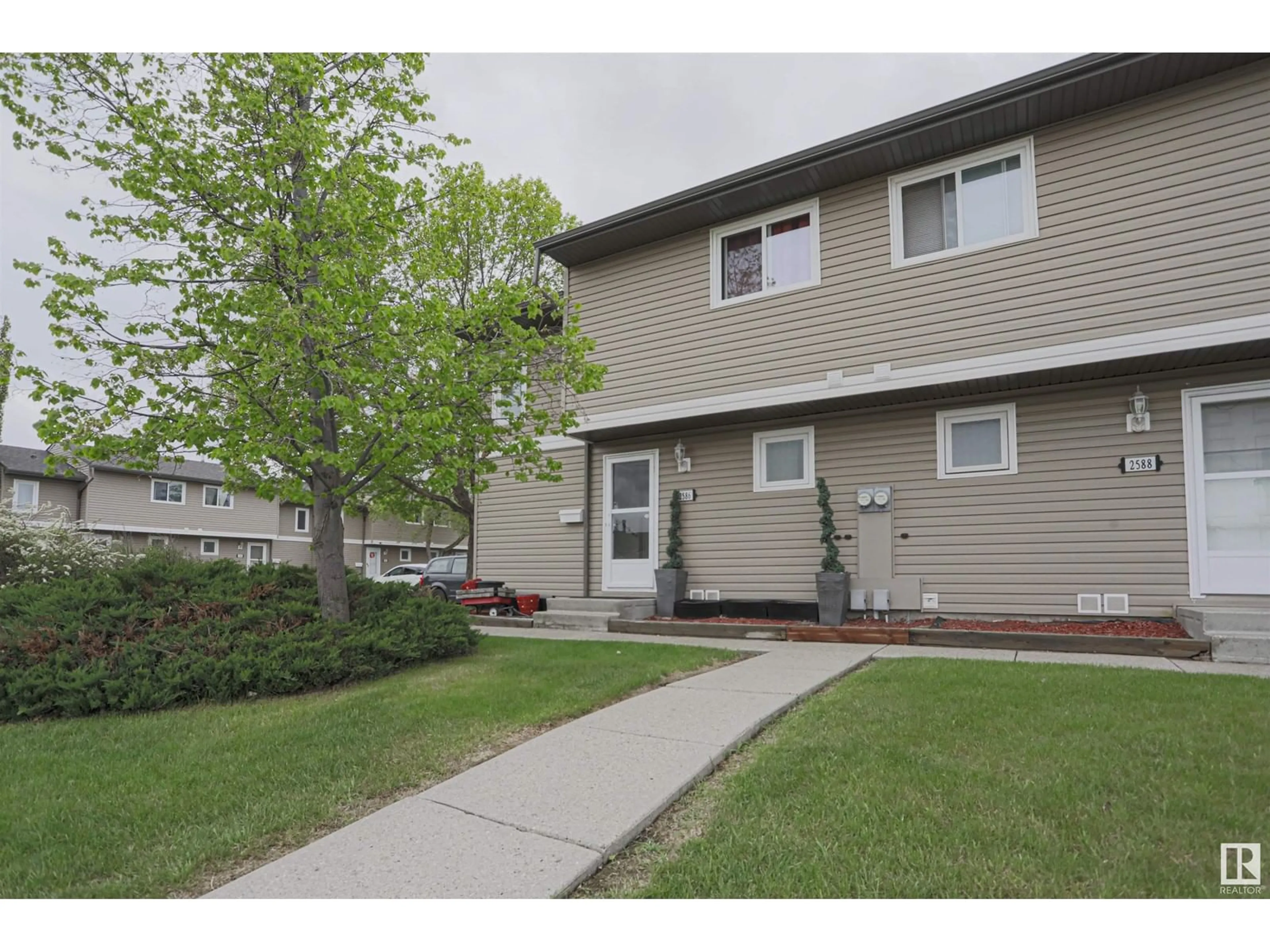 Home with vinyl exterior material, street for 2586 79 ST, Edmonton Alberta T6K3Y4
