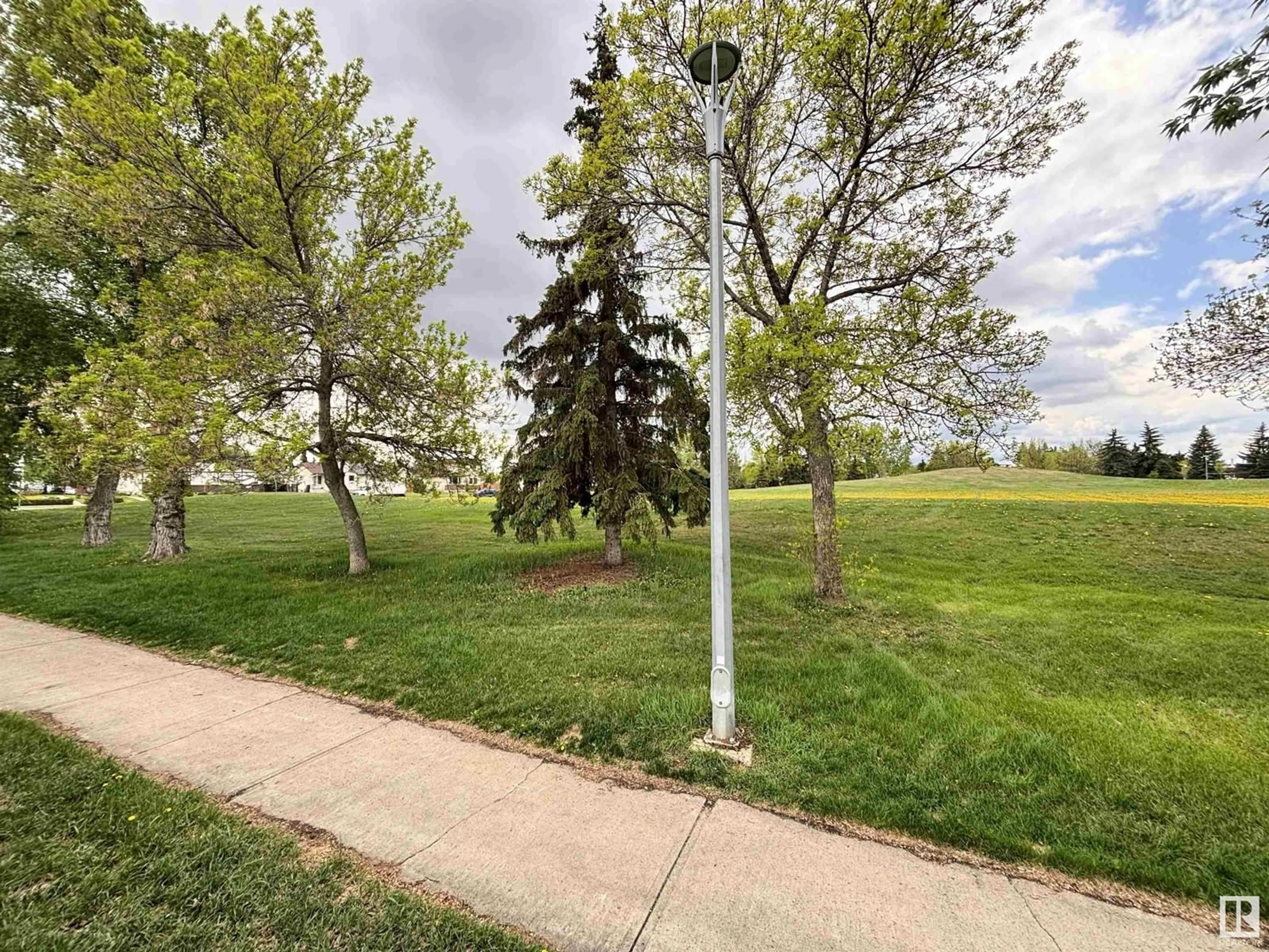 A pic from outside/outdoor area/front of a property/back of a property/a pic from drone, street for 7115 12 AV, Edmonton Alberta T6K3H6