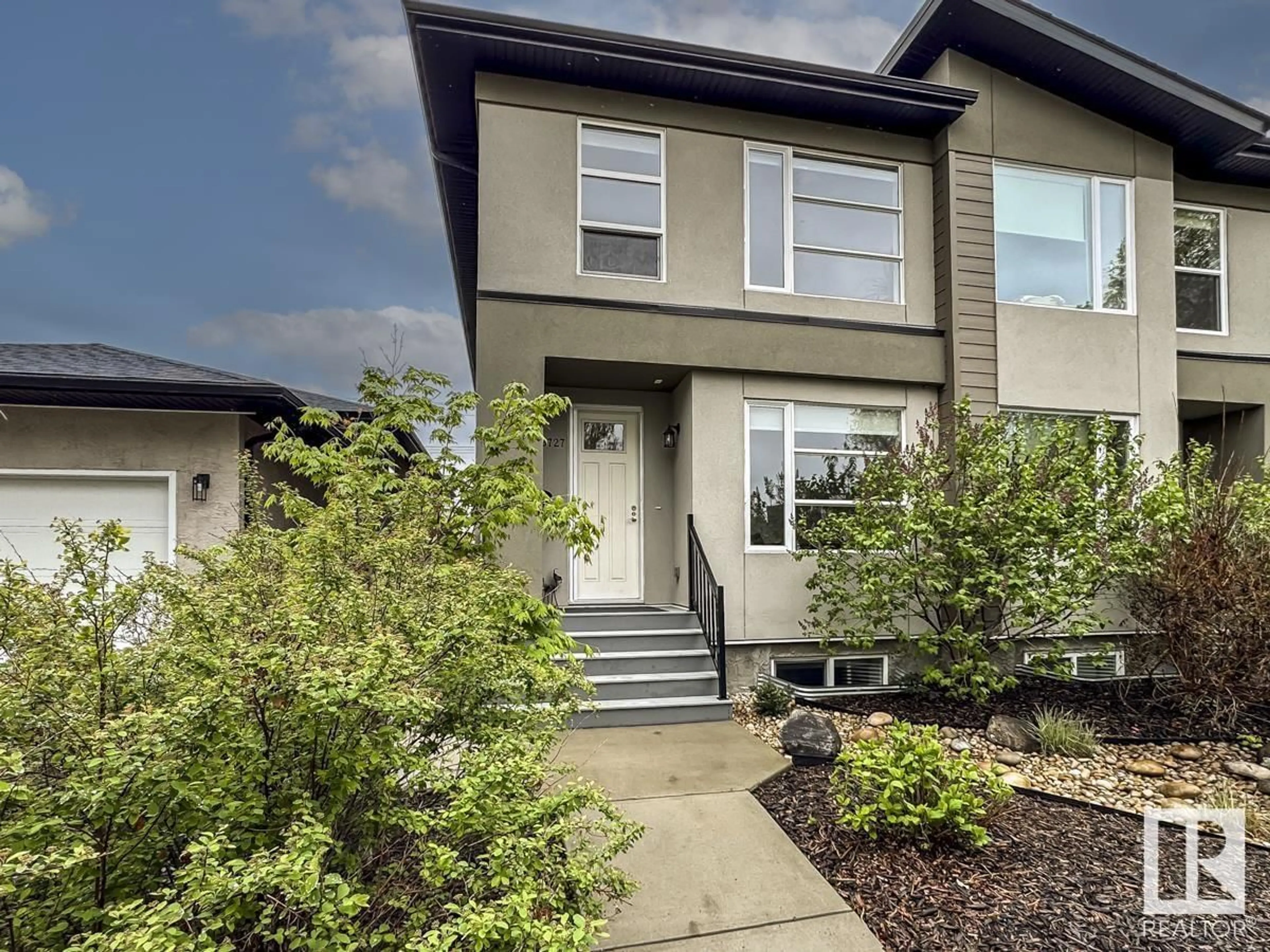 Home with vinyl exterior material, street for NW - 8727 77 AV, Edmonton Alberta T6C0L6