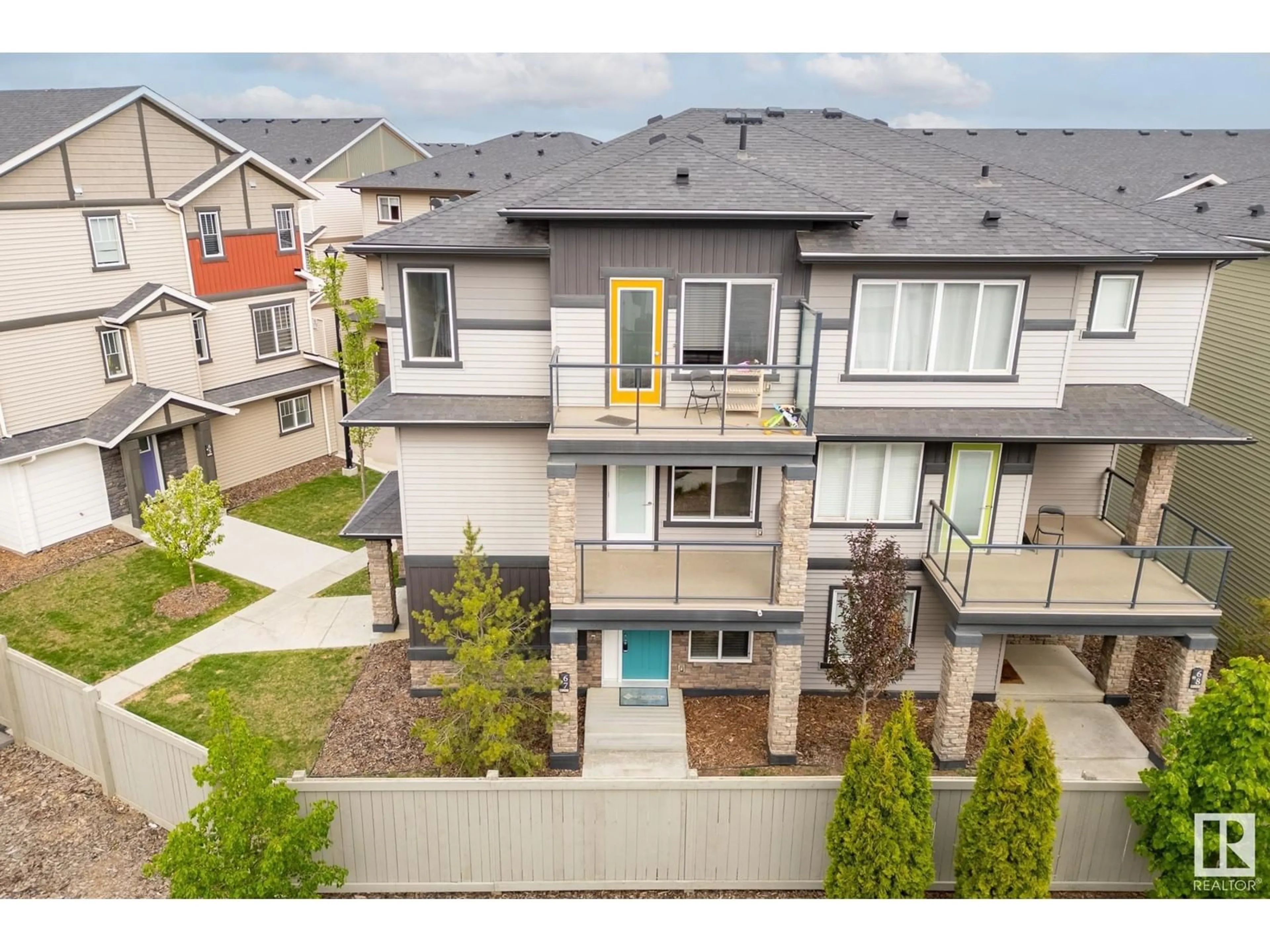 A pic from outside/outdoor area/front of a property/back of a property/a pic from drone, mountain view for 1530 - 67 TAMARACK BV, Edmonton Alberta T6T0V7
