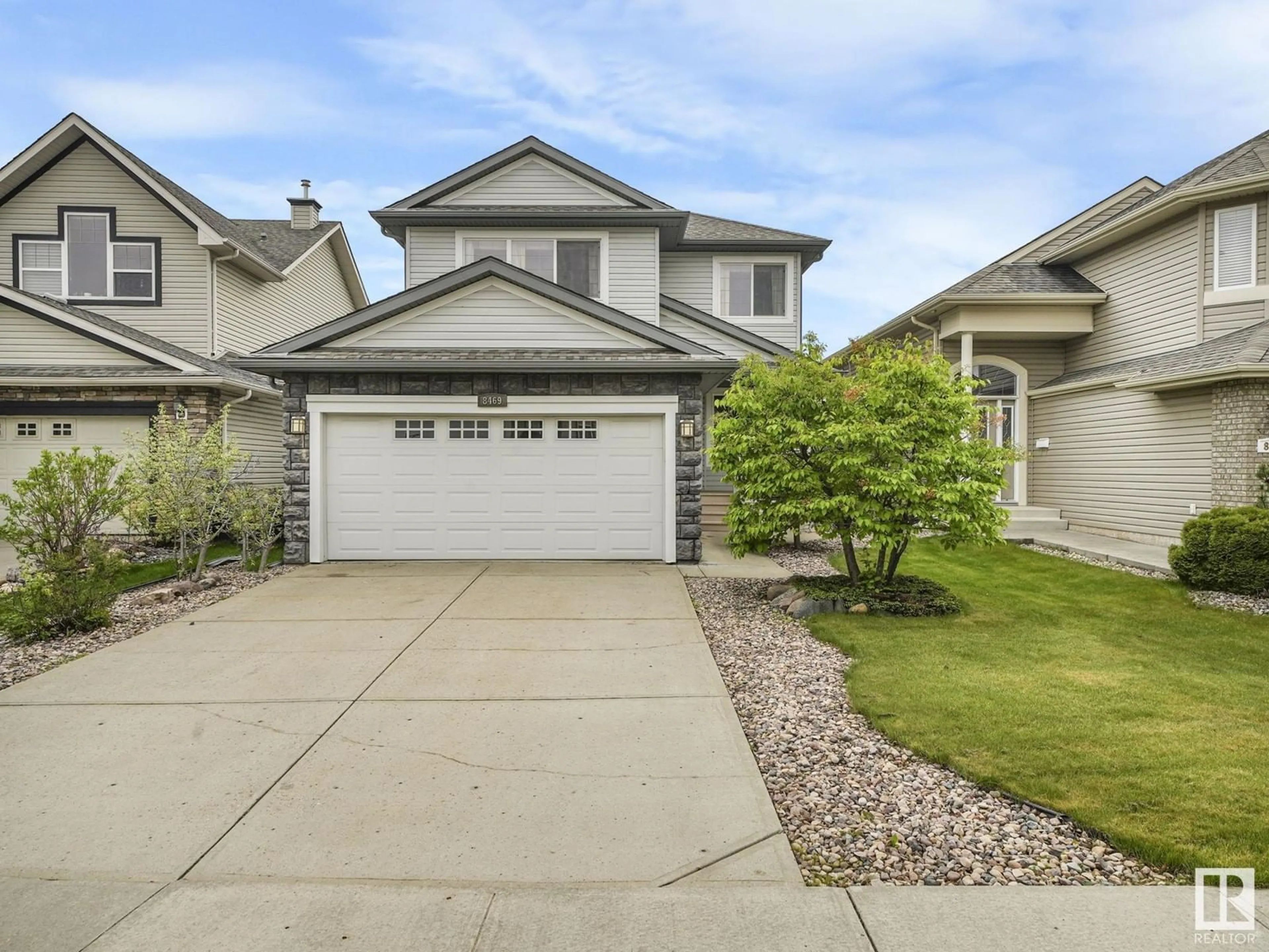 Home with vinyl exterior material, street for 8469 SLOANE CR, Edmonton Alberta T6R0L2