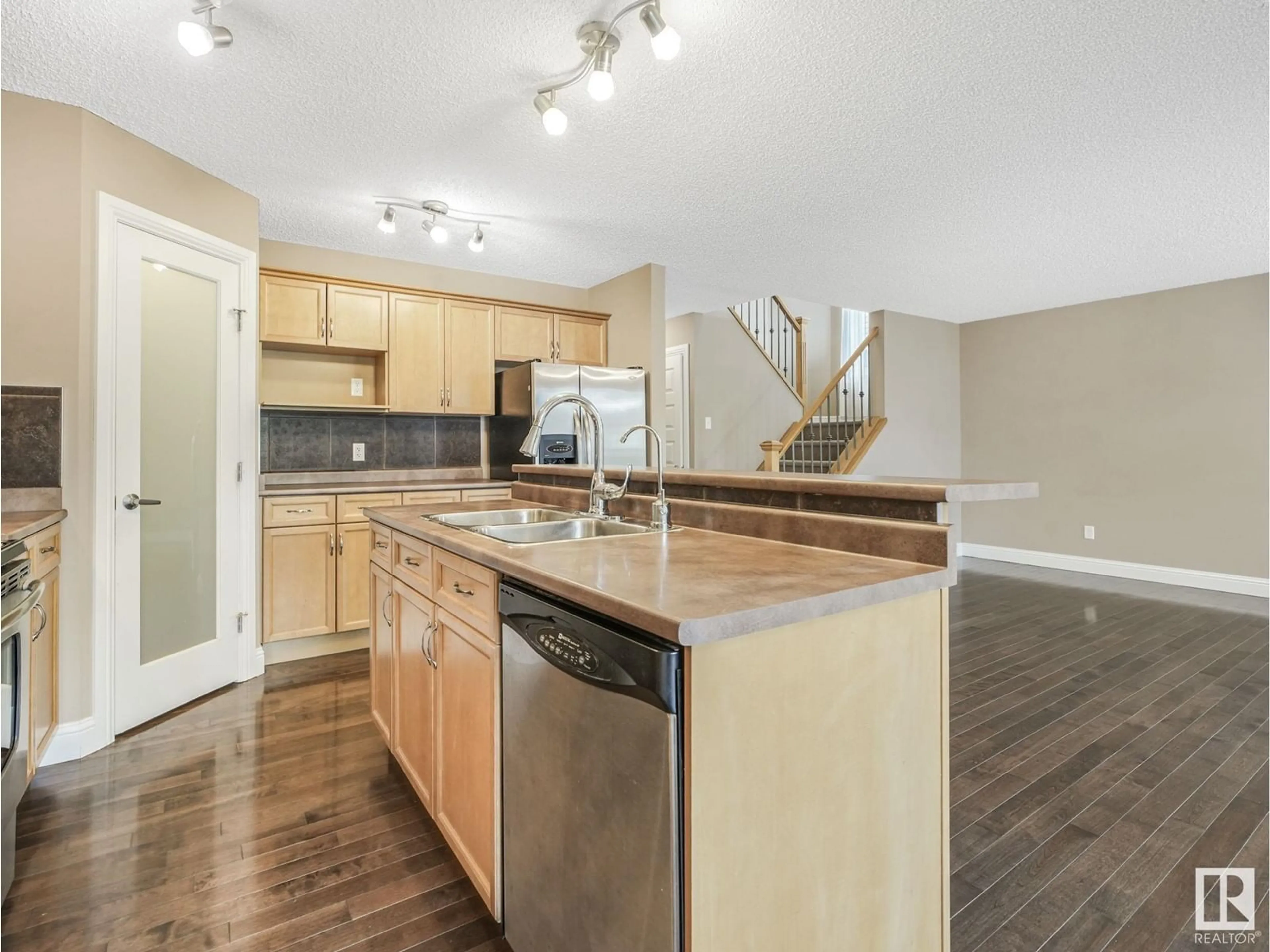 Open concept kitchen, wood/laminate floor for 8469 SLOANE CR, Edmonton Alberta T6R0L2