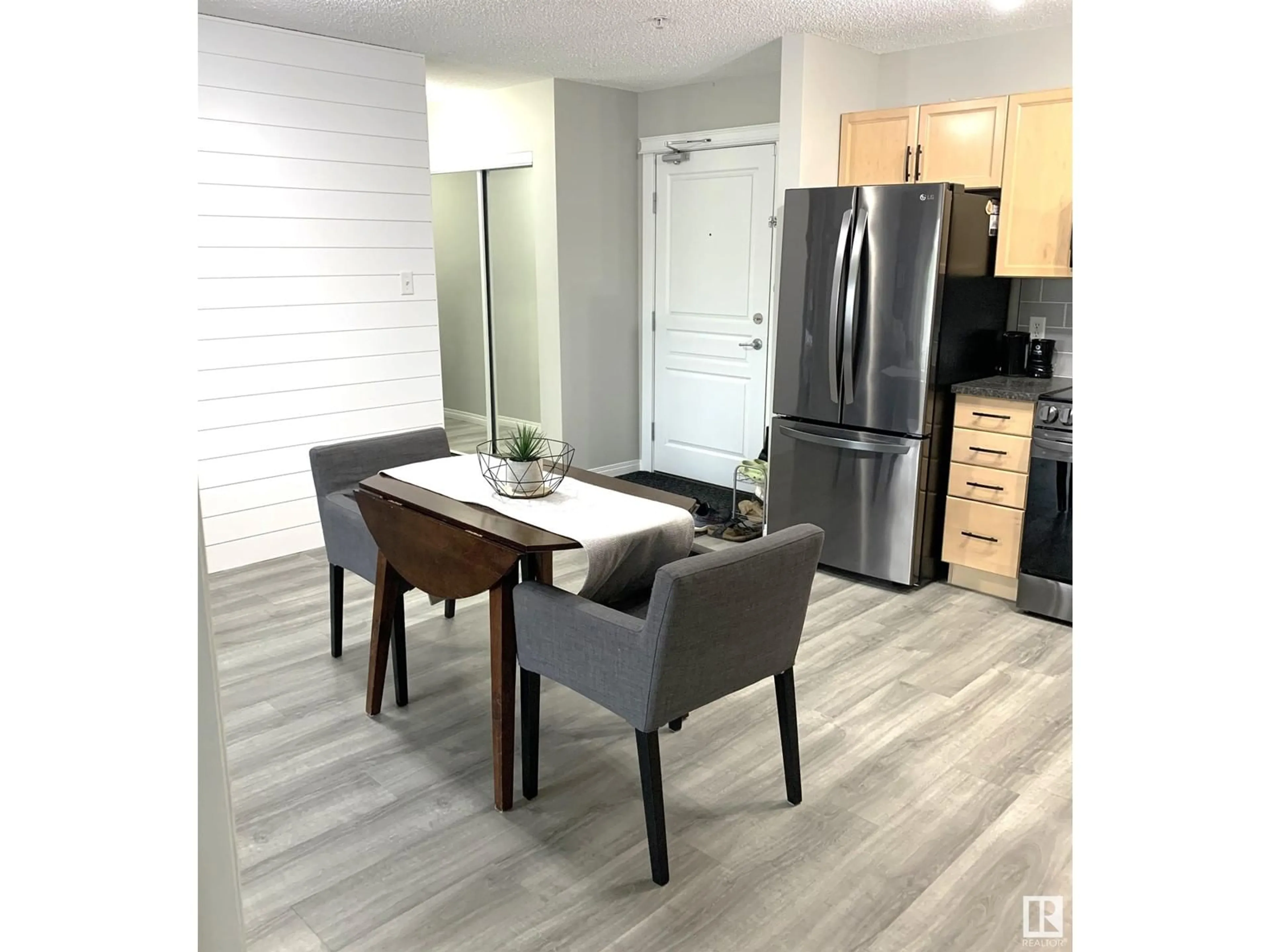 Open concept kitchen, wood/laminate floor for 309 - 118 CLAREVIEW STATION DR, Edmonton Alberta T5Y0C5