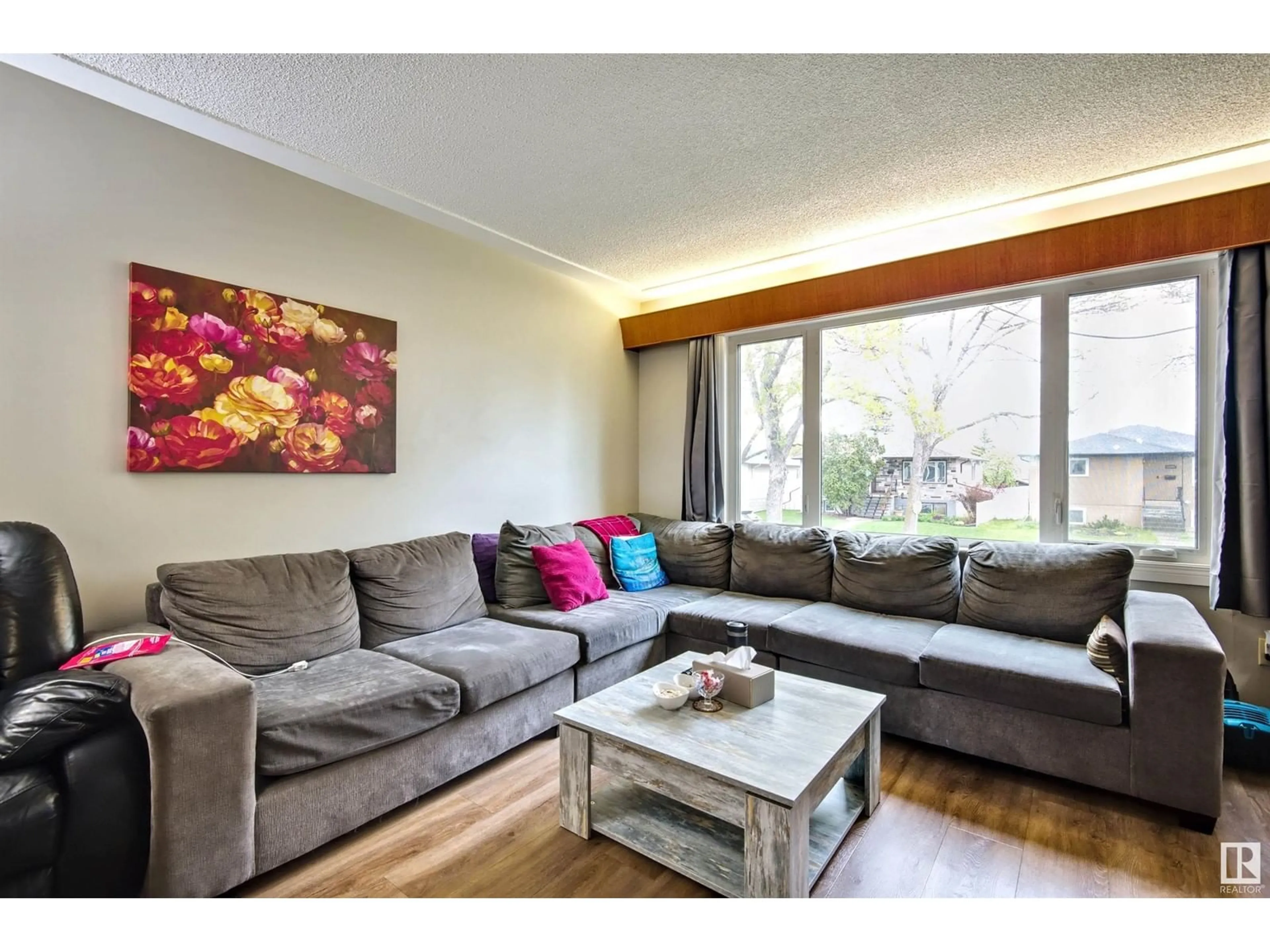 Living room with furniture, wood/laminate floor for NW - 13008-130010 102 ST, Edmonton Alberta T6H4B2