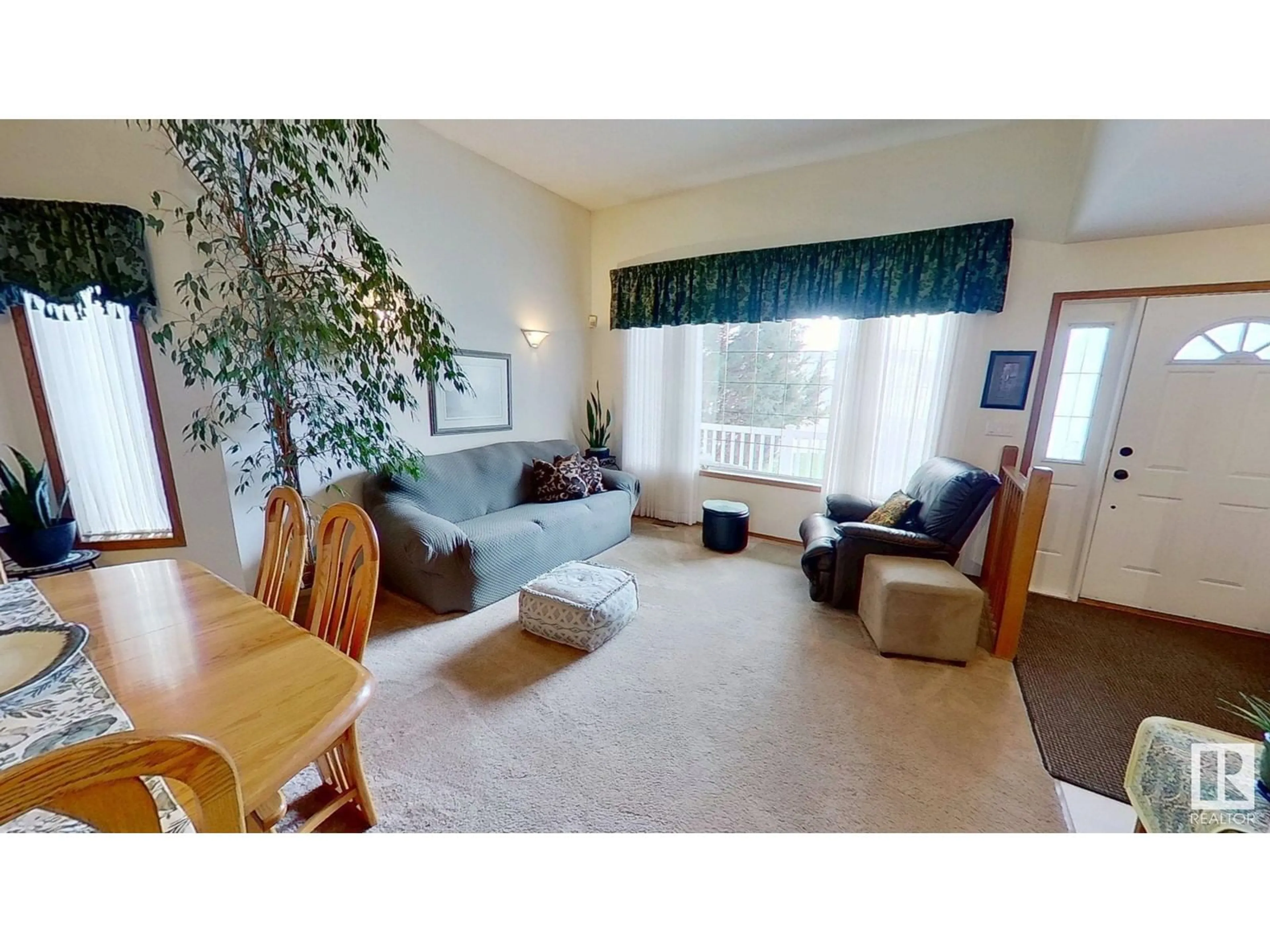 Living room with furniture, wood/laminate floor for 3935 31 ST, Edmonton Alberta T6T1J6
