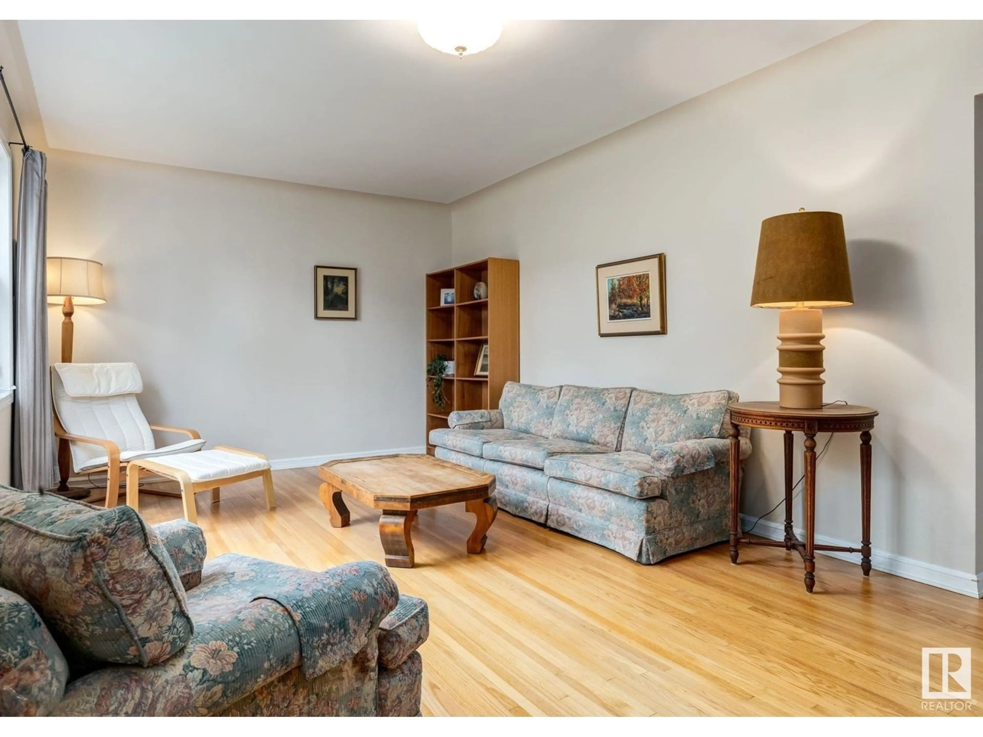Living room with furniture, wood/laminate floor for 11454 79 AV, Edmonton Alberta T6G0P6