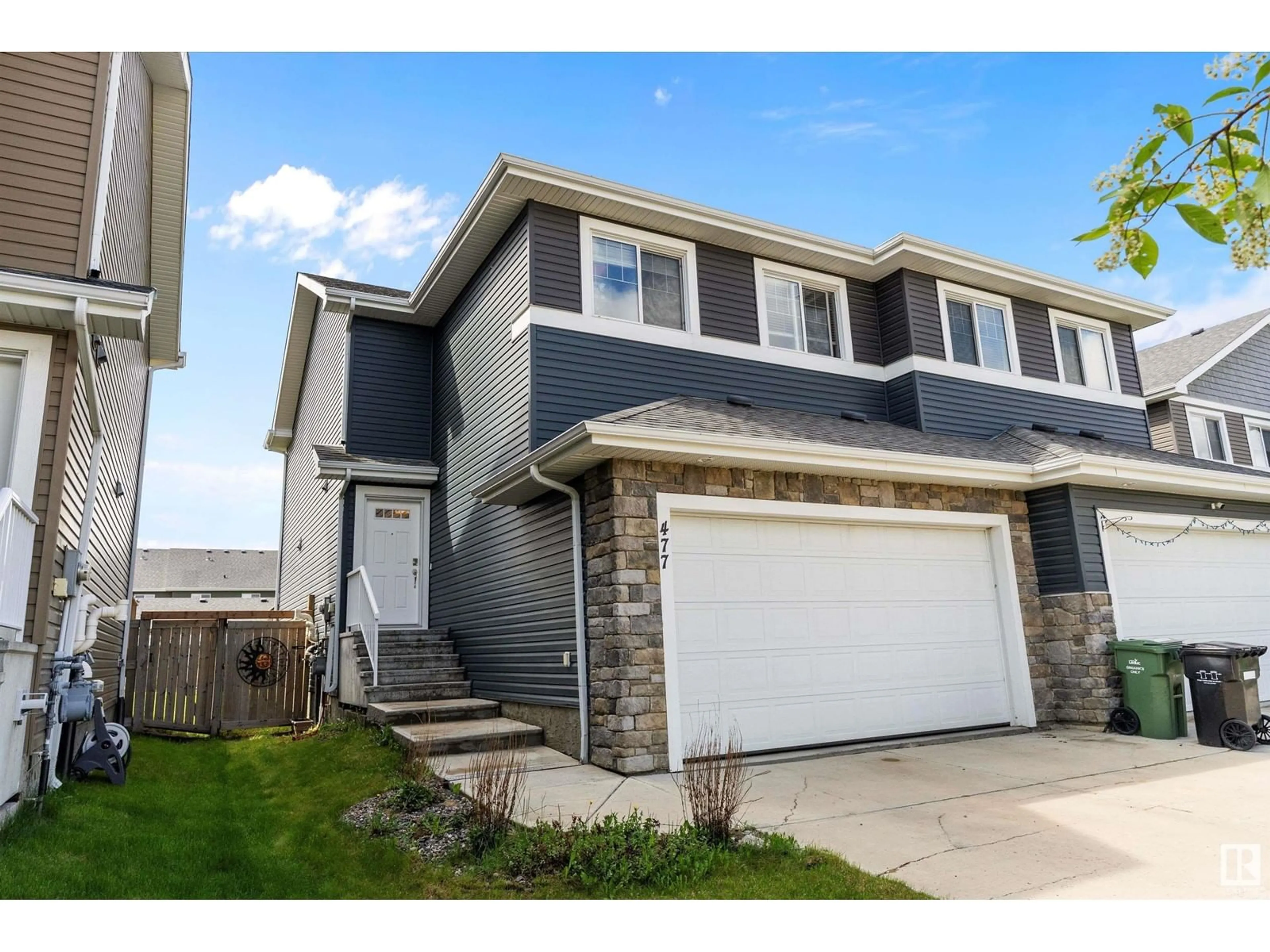 Home with vinyl exterior material, street for 477 REED CR, Leduc Alberta T9E0R5