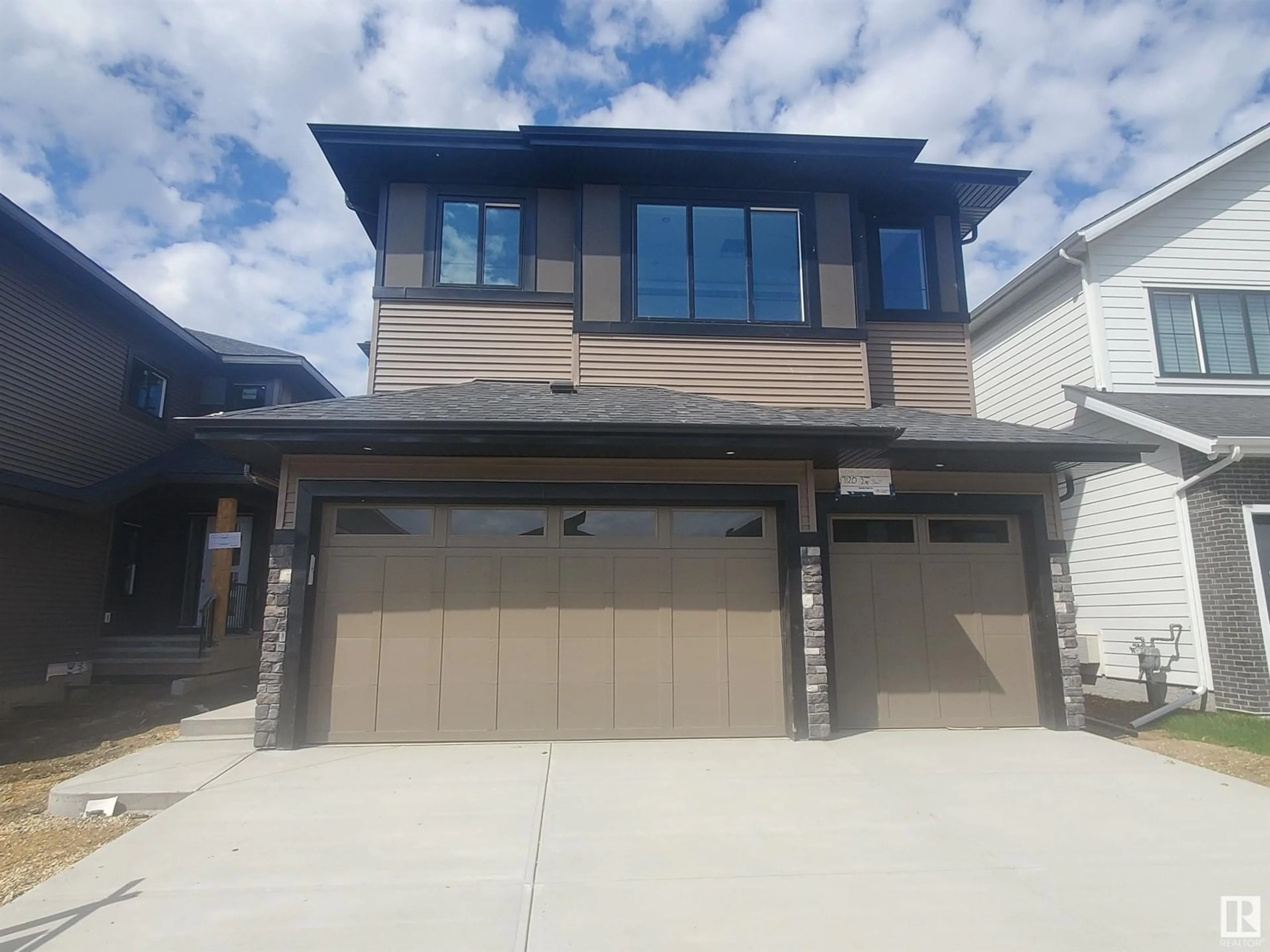 Home with vinyl exterior material, street for 17120 2 ST, Edmonton Alberta T5Y4G5