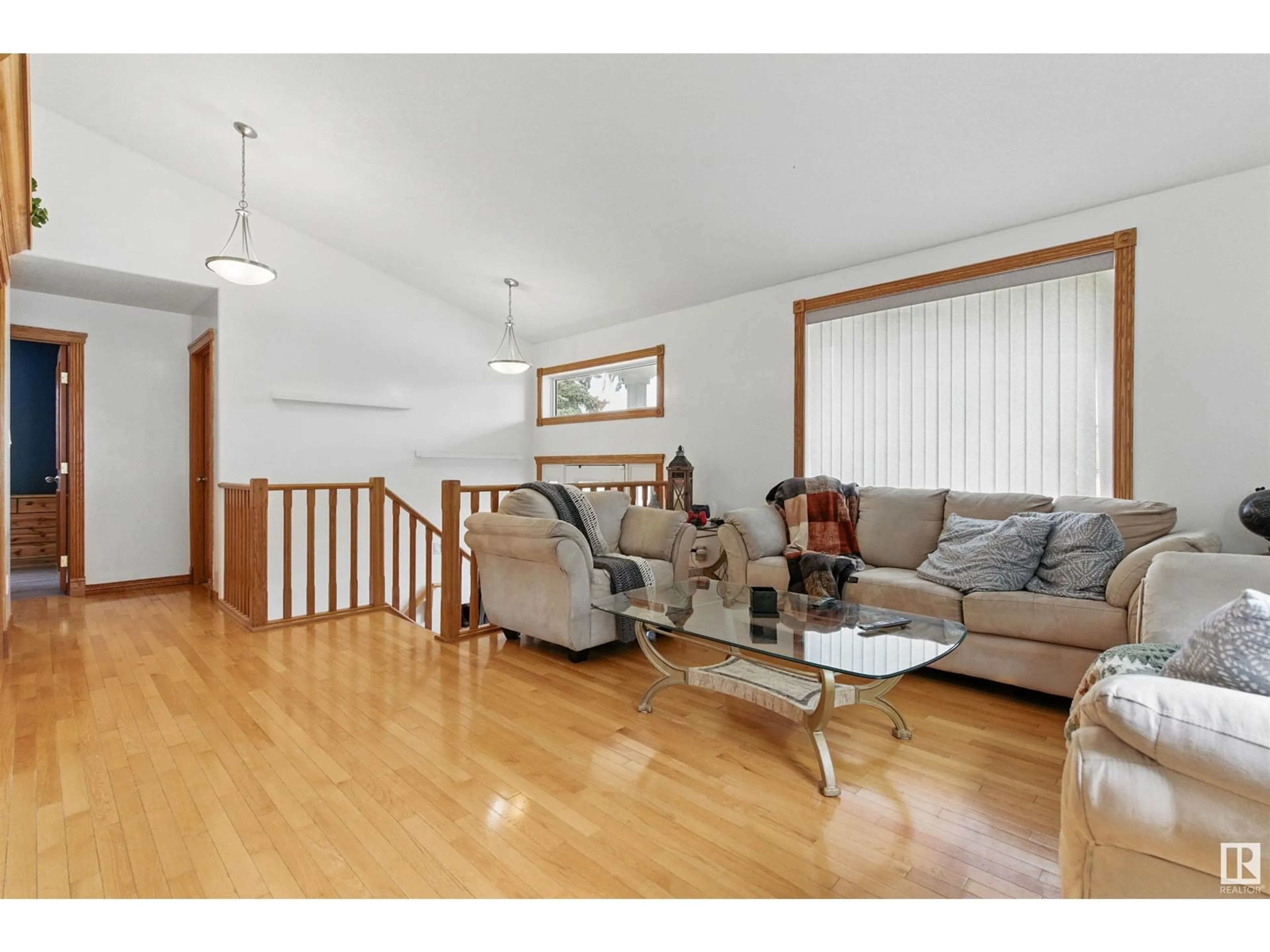 Living room with furniture, wood/laminate floor for NW - 9716 160 ST, Edmonton Alberta T5P3C8