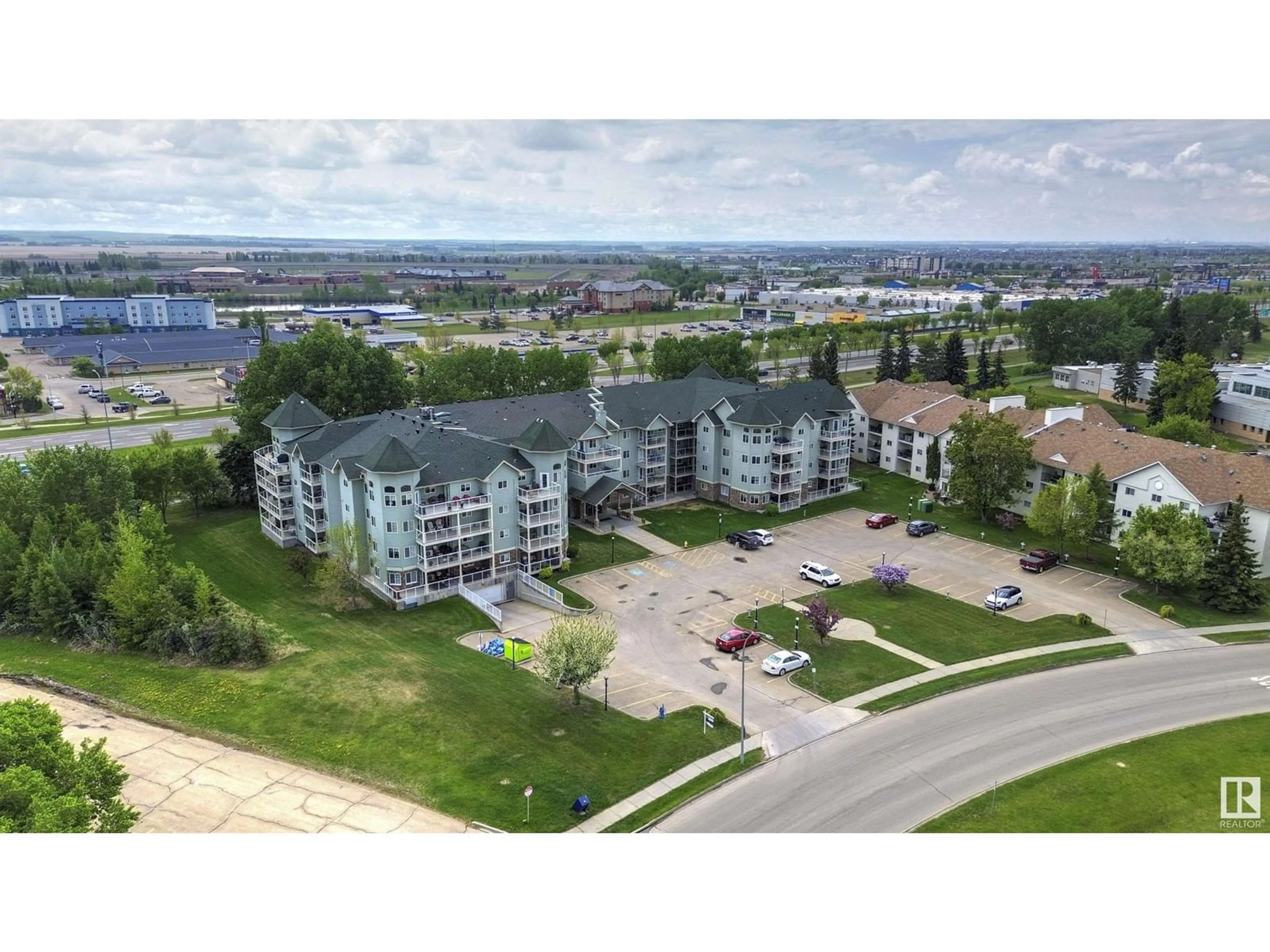 A pic from outside/outdoor area/front of a property/back of a property/a pic from drone, water/lake/river/ocean view for #305 - 9995 93 AV, Fort Saskatchewan Alberta T8L1N5