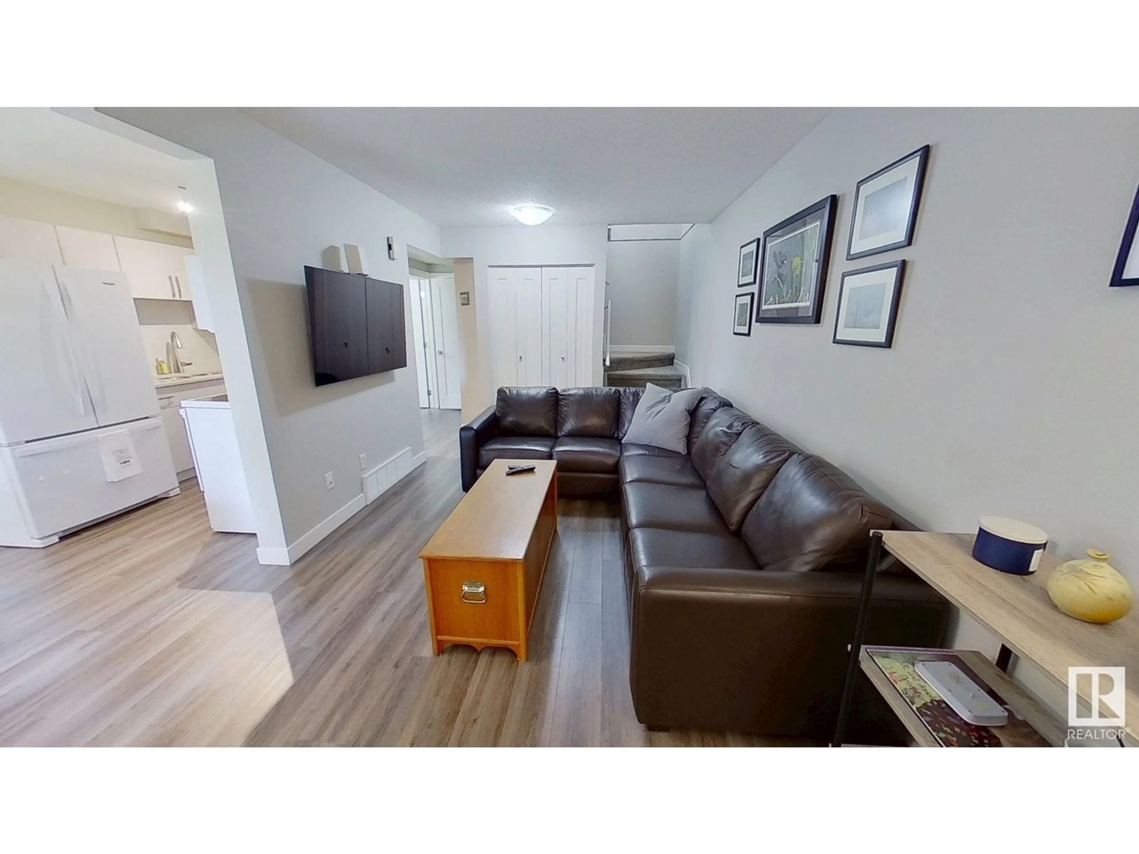Living room with furniture, wood/laminate floor for 17D IMPERIAL CR, Devon Alberta T9G1K3