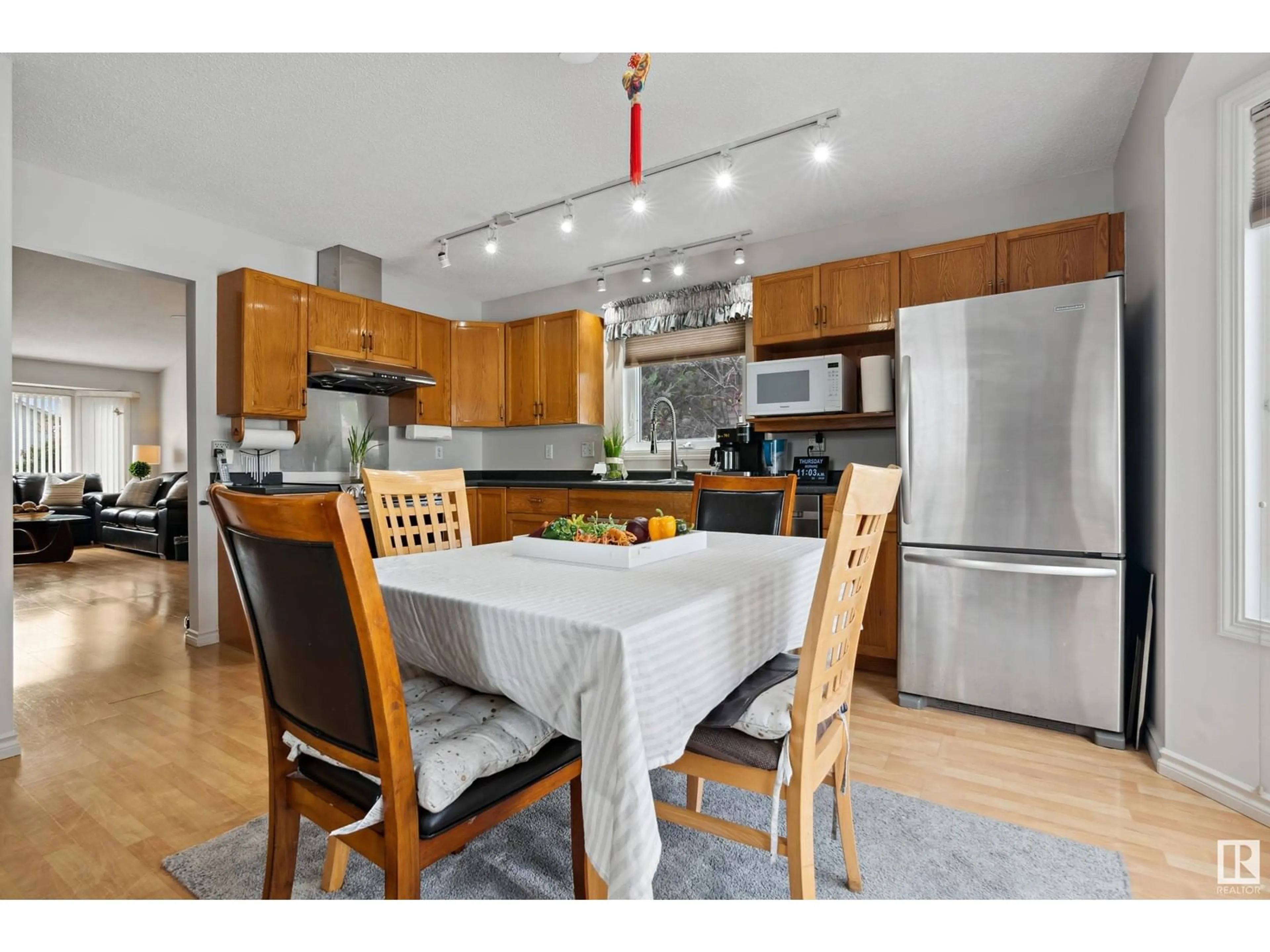 Open concept kitchen, wood/laminate floor for 16 CIMMARON WY, Sherwood Park Alberta T8H1C7
