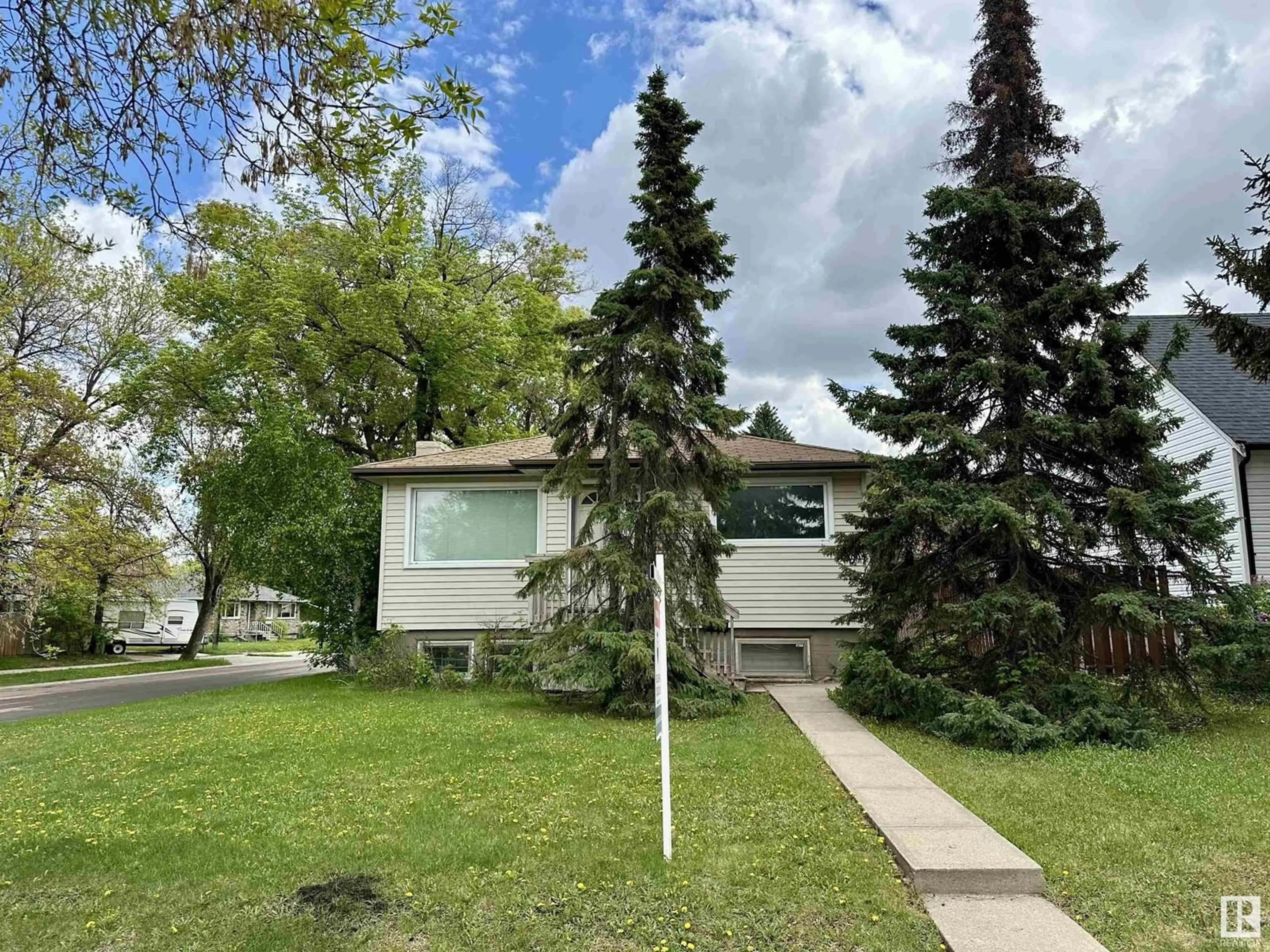 Home with vinyl exterior material, street for 10471 146 ST, Edmonton Alberta T5N3A5
