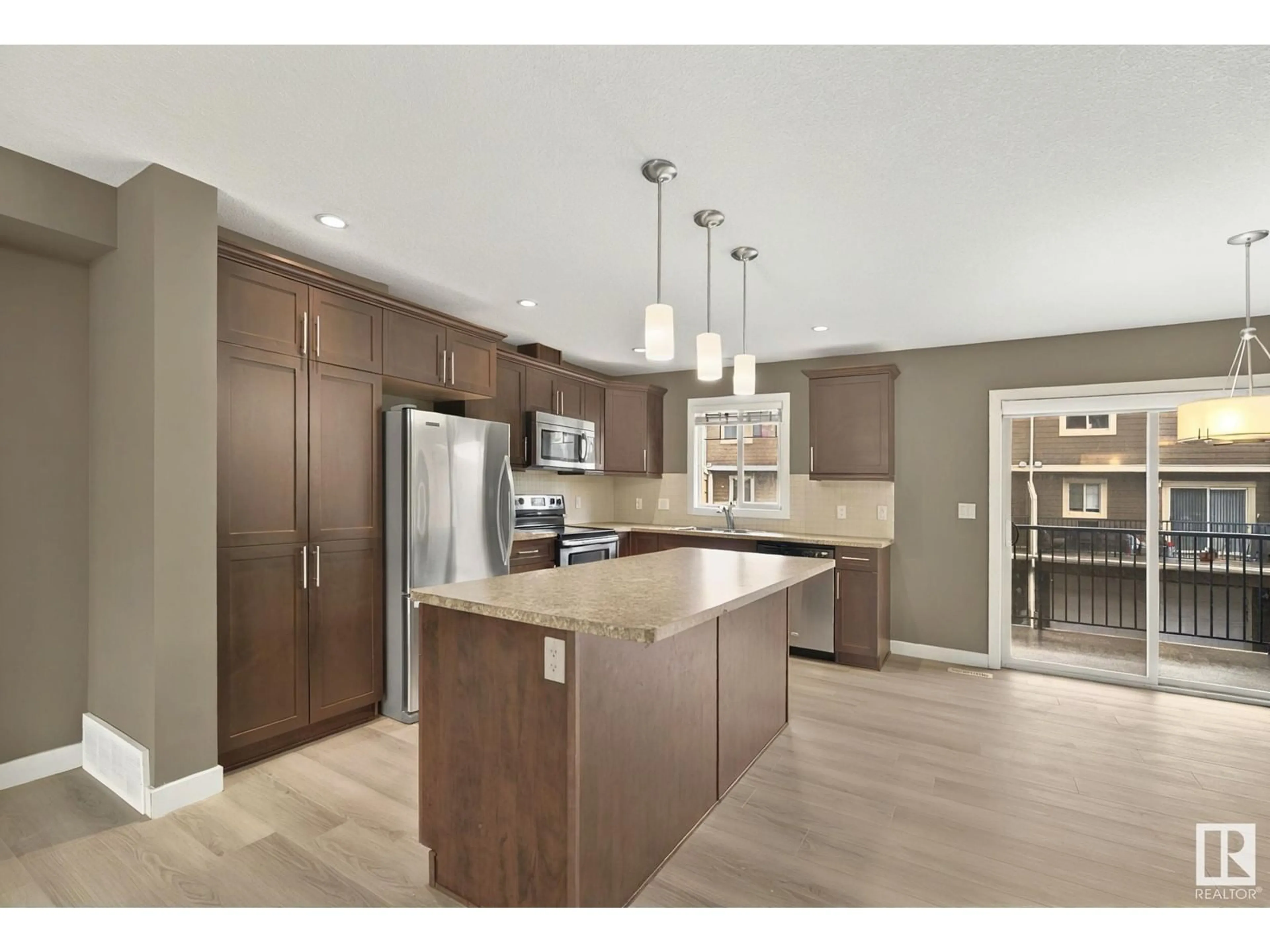 Open concept kitchen, wood/laminate floor for #203 - 401 PALISADES WY, Sherwood Park Alberta T8H0R7