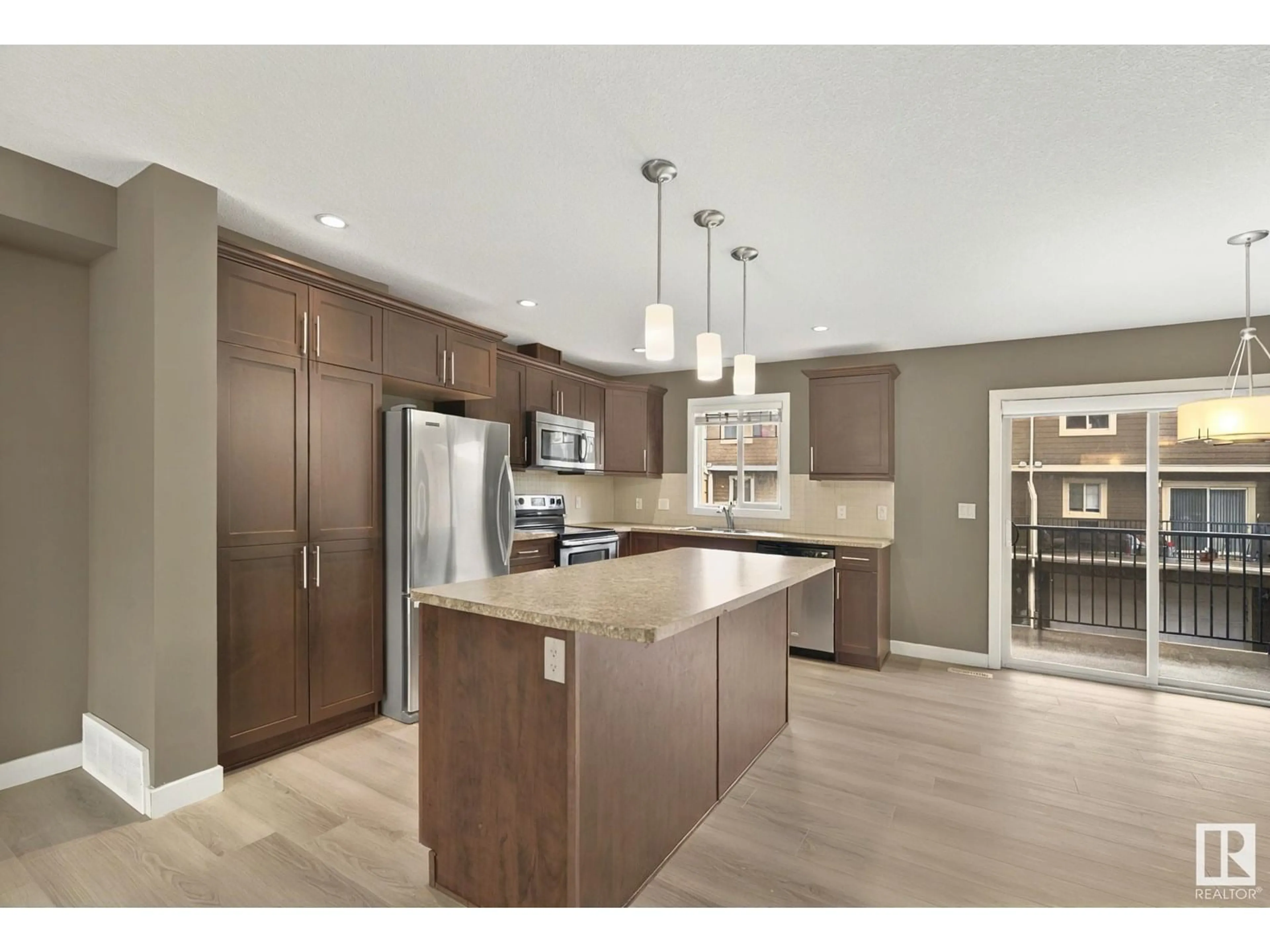 Open concept kitchen, wood/laminate floor for #203 - 401 PALISADES WY, Sherwood Park Alberta T8H0R7