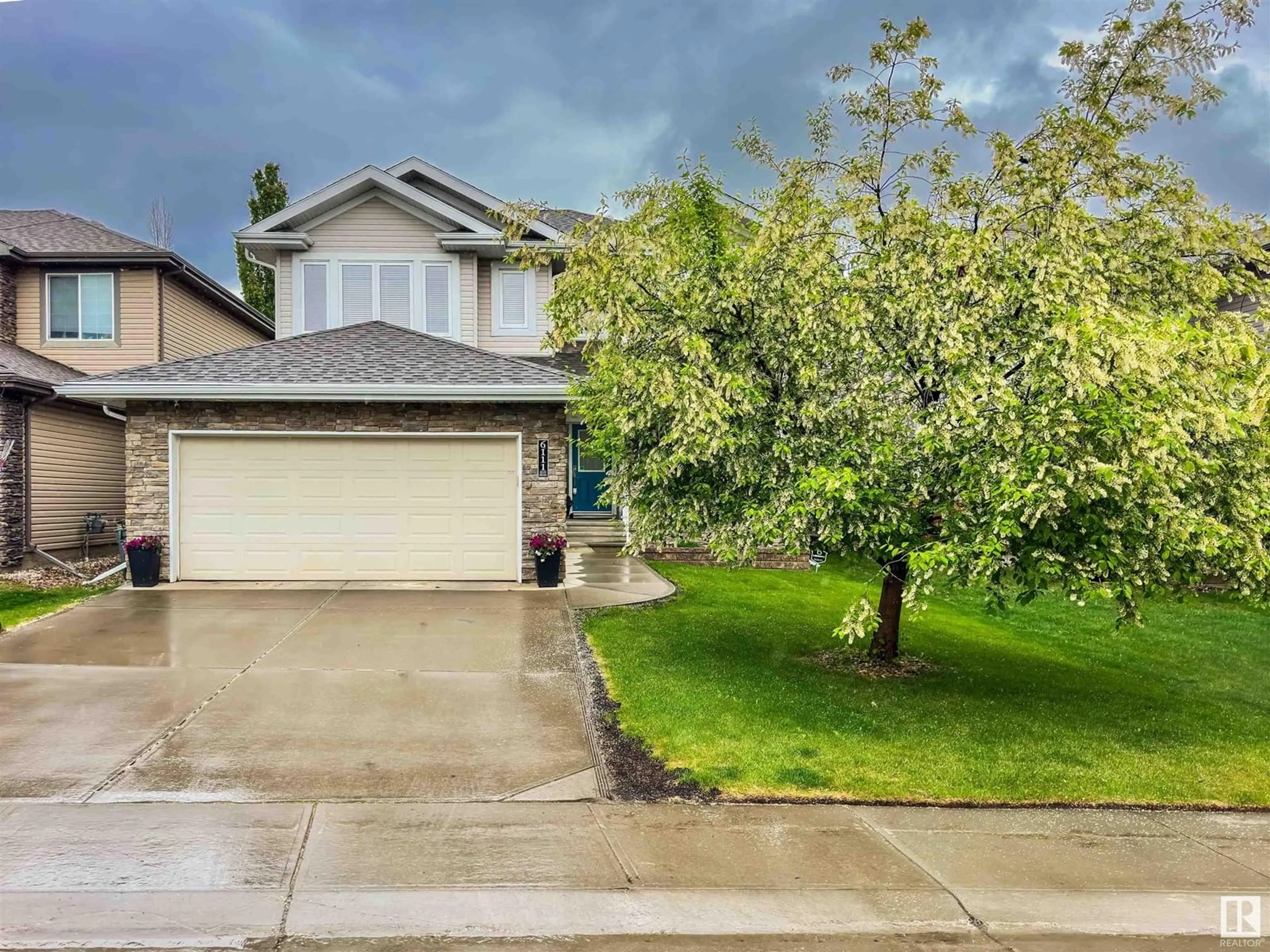 Home with vinyl exterior material, street for 6111 MAYNARD CR, Edmonton Alberta T6R0J2