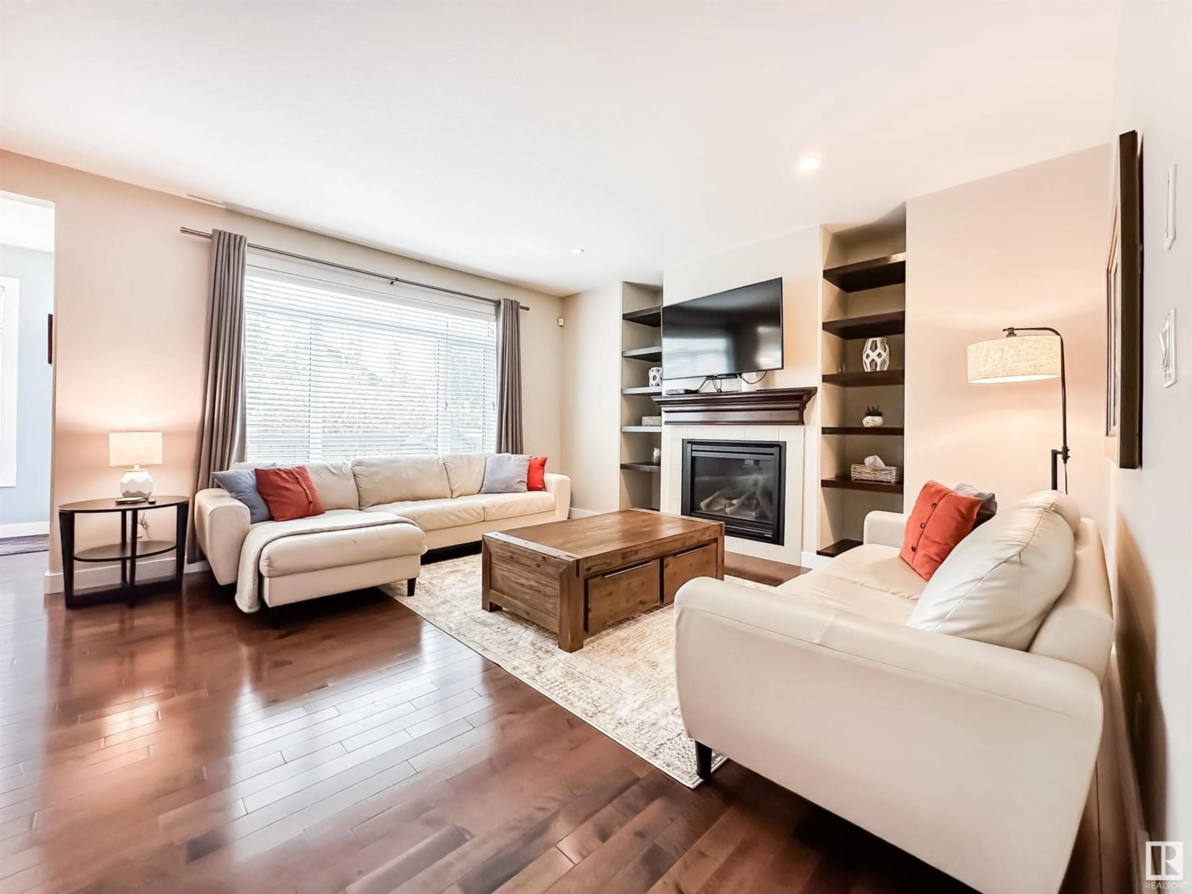 Living room with furniture, wood/laminate floor for 6111 MAYNARD CR, Edmonton Alberta T6R0J2
