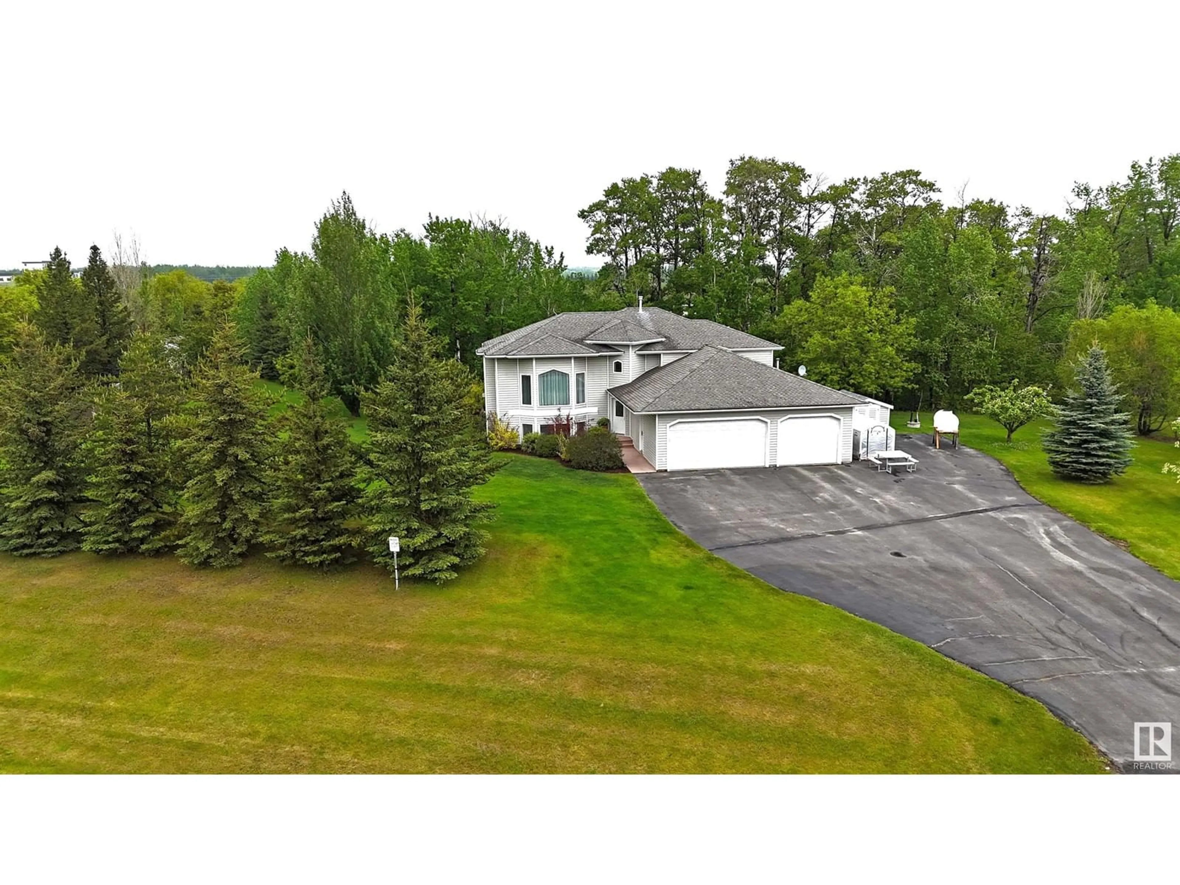 A pic from outside/outdoor area/front of a property/back of a property/a pic from drone, unknown for #6 - 53122 RGE ROAD 14, Rural Parkland County Alberta T7Y2T3