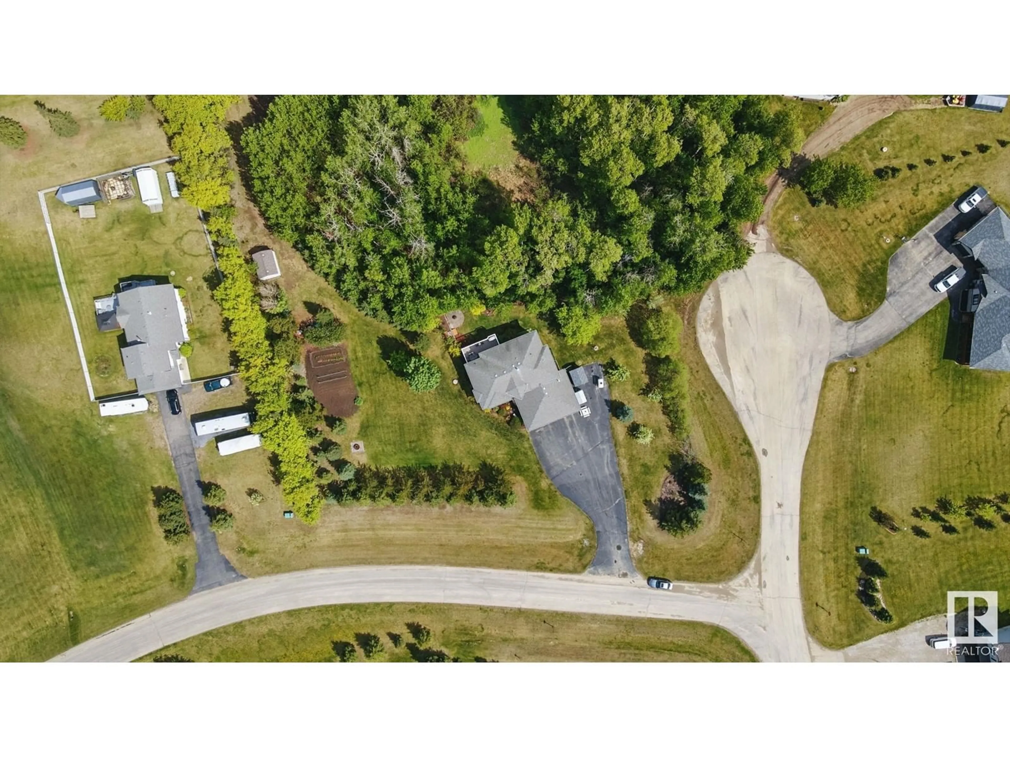 A pic from outside/outdoor area/front of a property/back of a property/a pic from drone, unknown for #6 - 53122 RGE ROAD 14, Rural Parkland County Alberta T7Y2T3