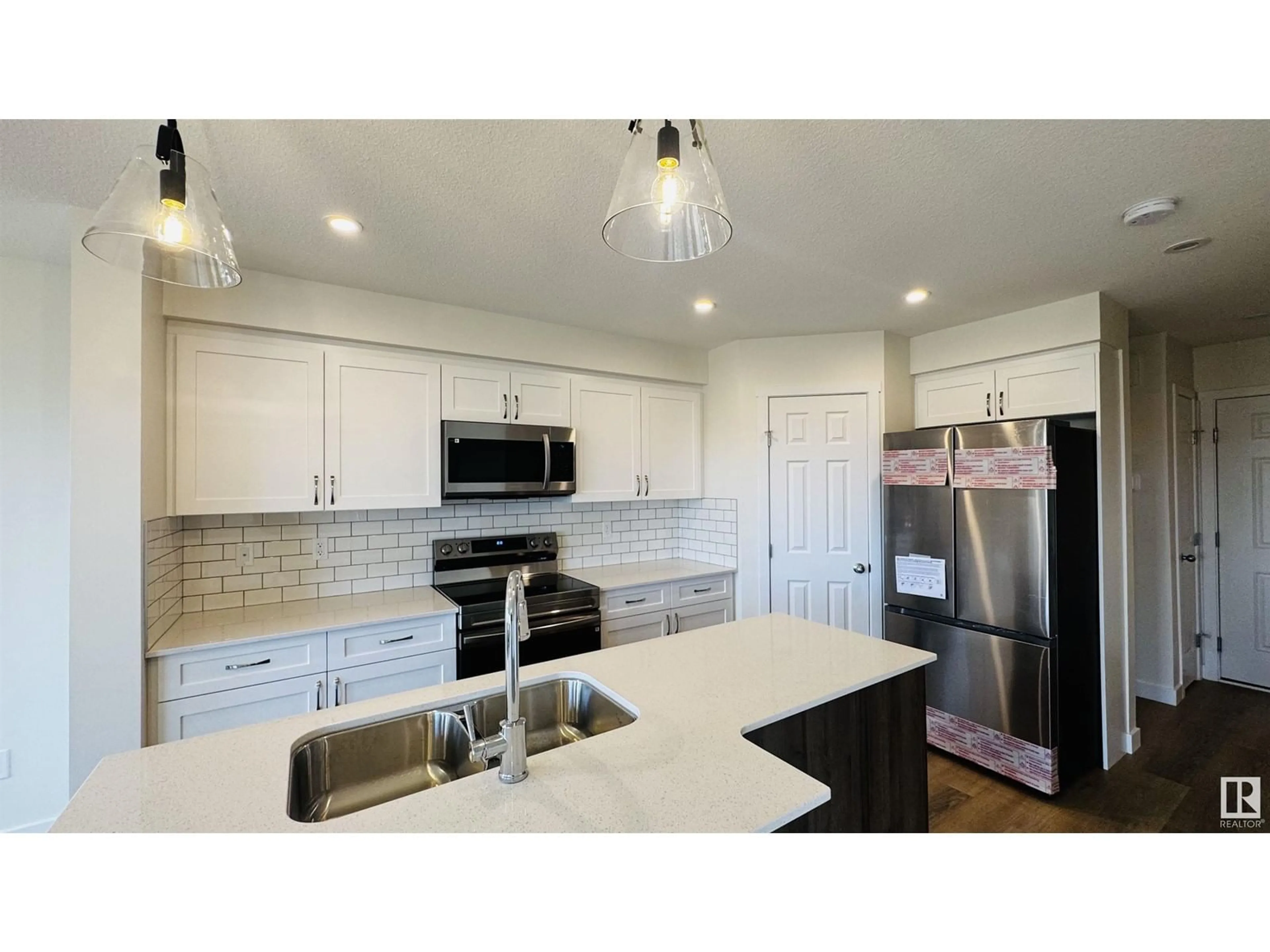 Open concept kitchen, ceramic/tile floor for 19130 29 AV, Edmonton Alberta T6M3B5