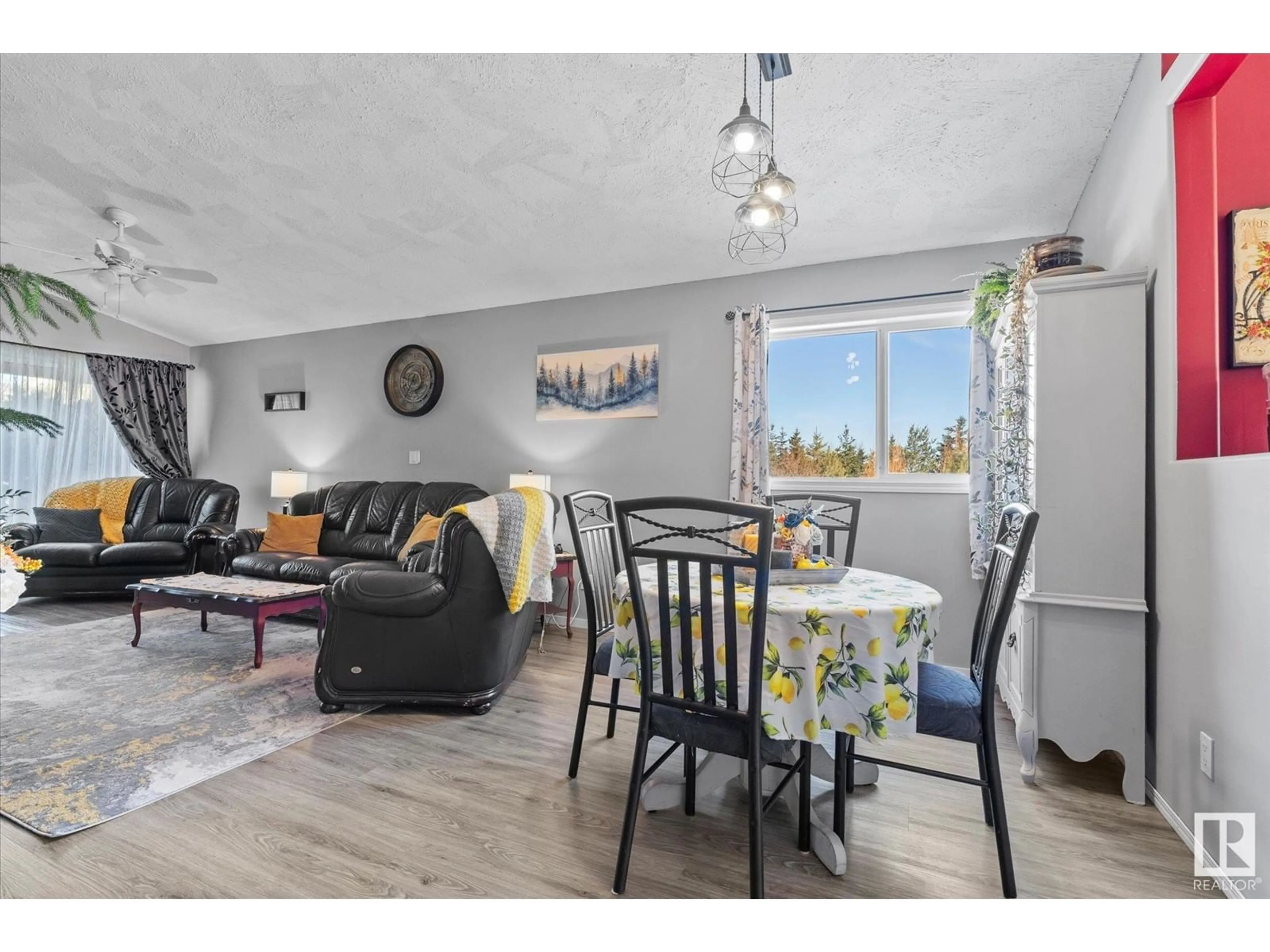 Living room with furniture, wood/laminate floor for 57126 - 66 RGE ROAD 233, Rural Sturgeon County Alberta T0A1N5