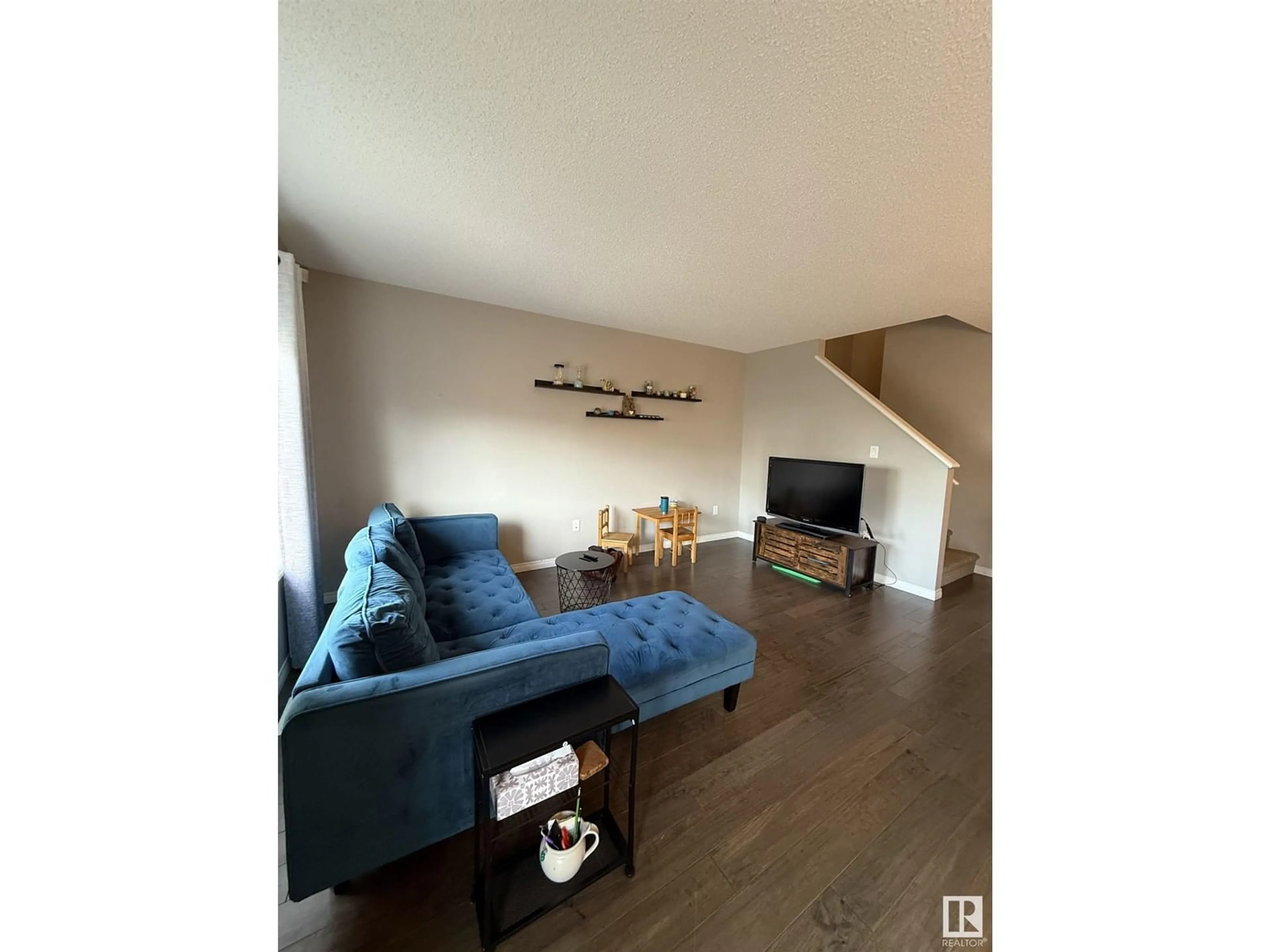 Living room with furniture, unknown for 2110 86 ST, Edmonton Alberta T6X2G2