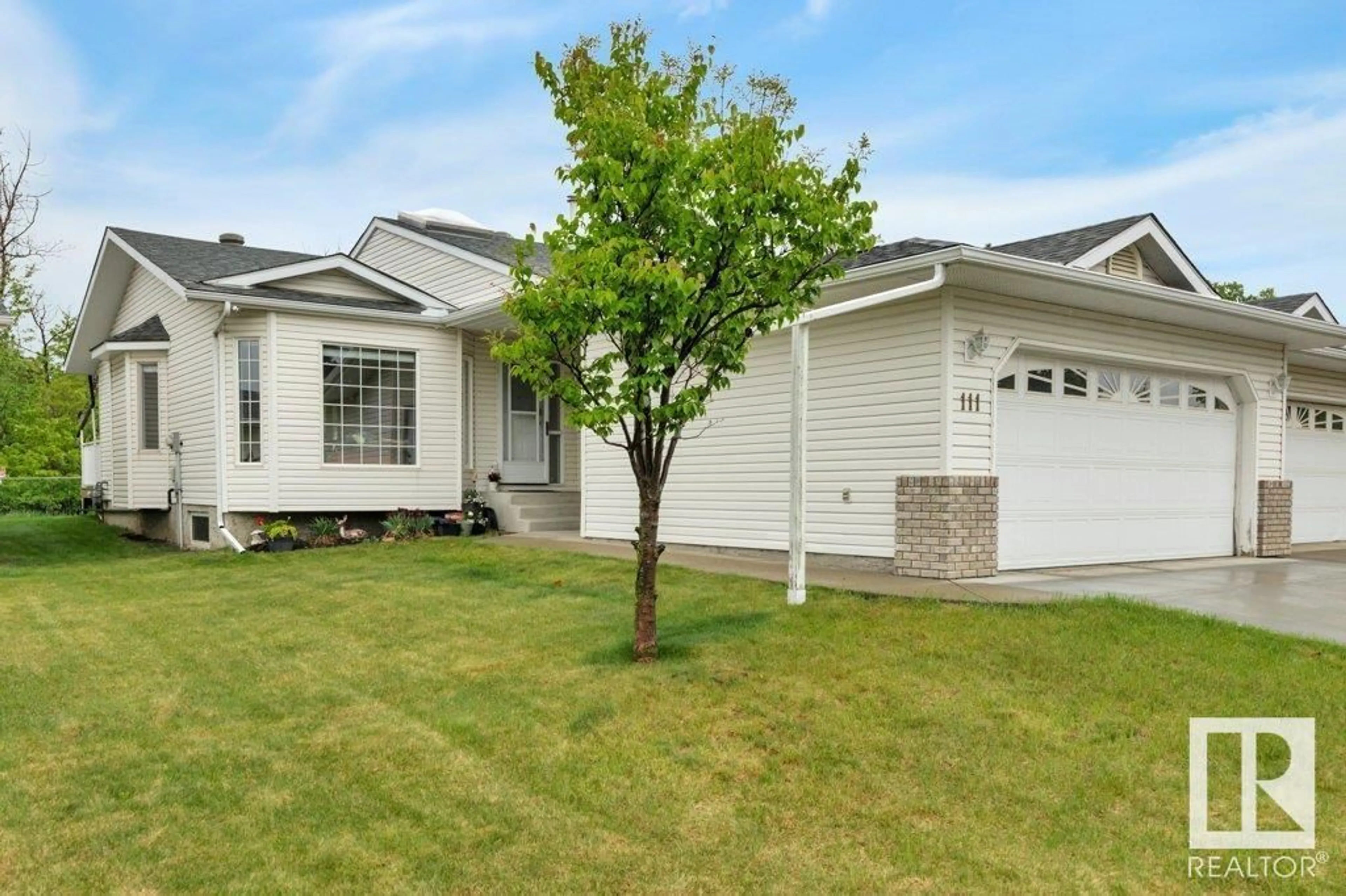 Home with vinyl exterior material, street for 111 RAVINE VI, Leduc Alberta T9E6R1