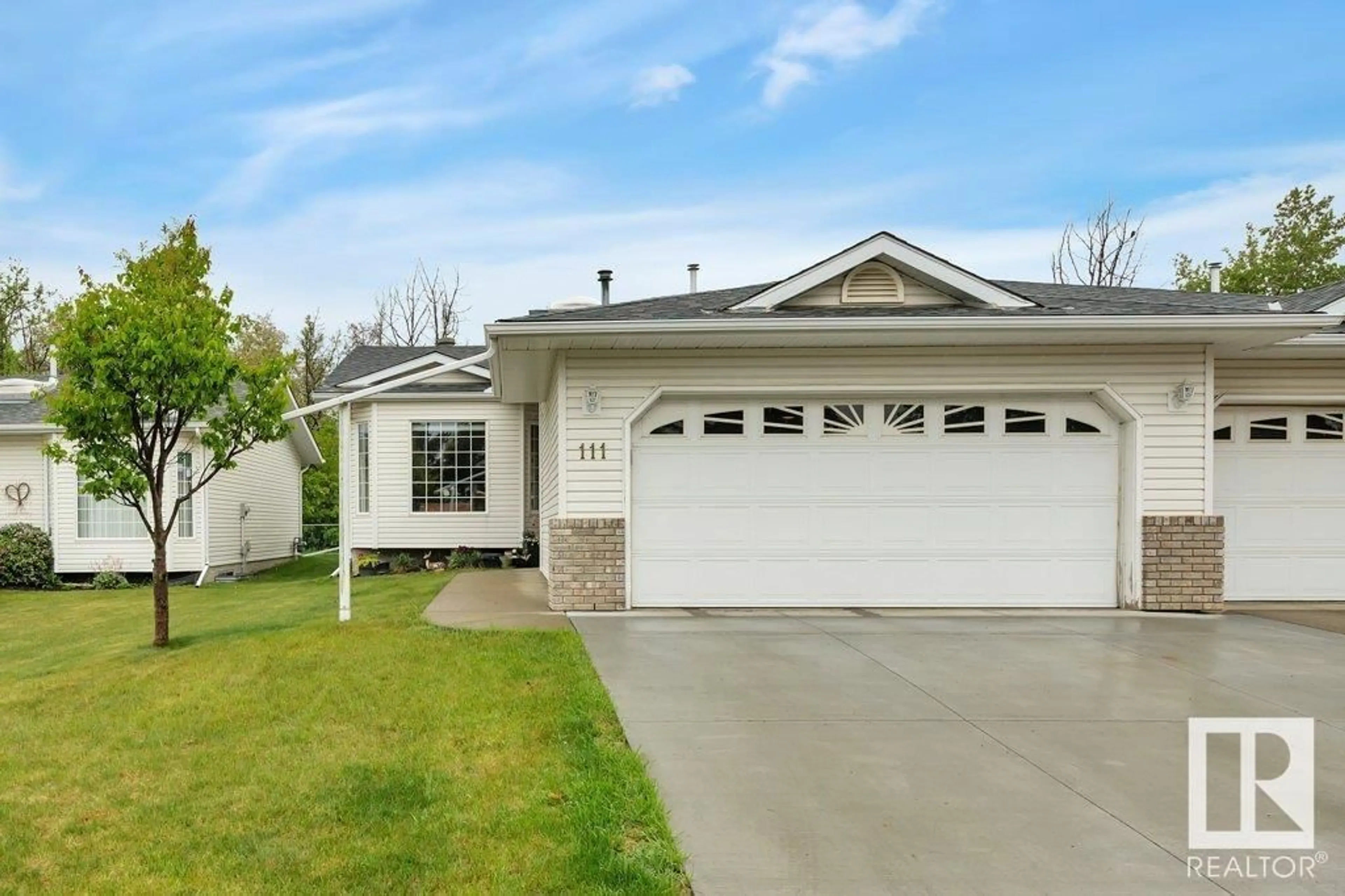 Home with vinyl exterior material, street for 111 RAVINE VI, Leduc Alberta T9E6R1