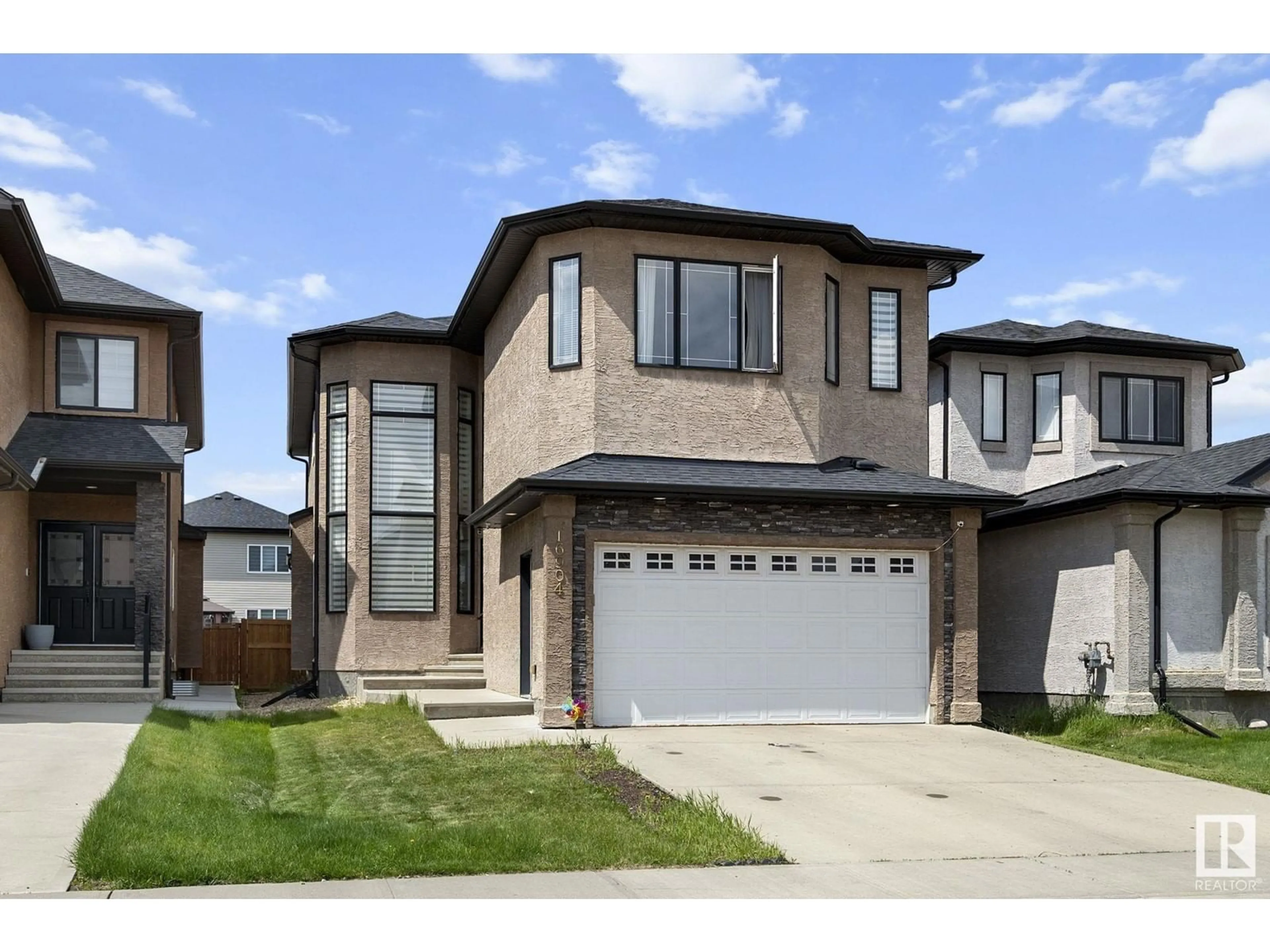 Home with vinyl exterior material, street for NW - 16904 62 ST, Edmonton Alberta T5Y3K4