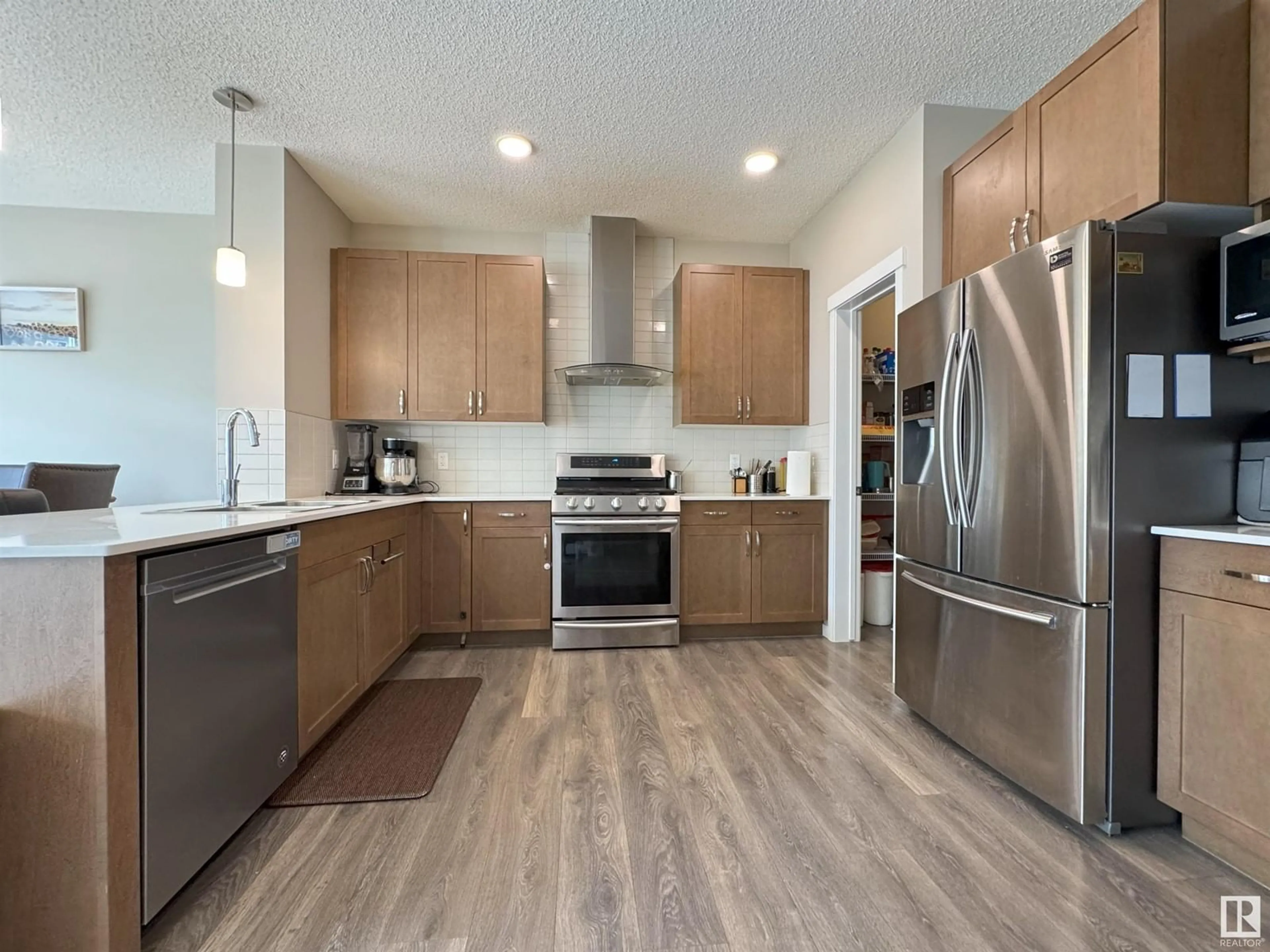 Contemporary kitchen, wood/laminate floor for 1229 27 ST, Edmonton Alberta T6T2J3