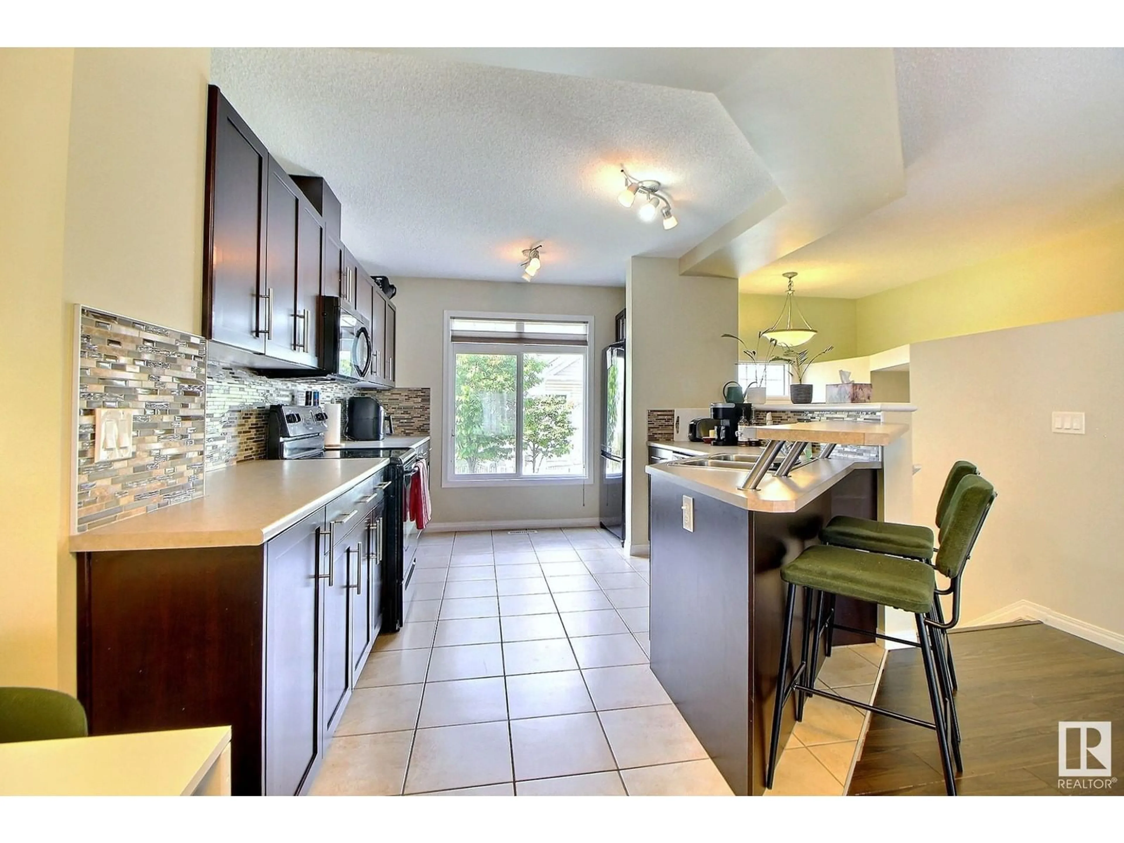 Open concept kitchen, ceramic/tile floor for #143 - 1804 70 ST, Edmonton Alberta T6X0H4
