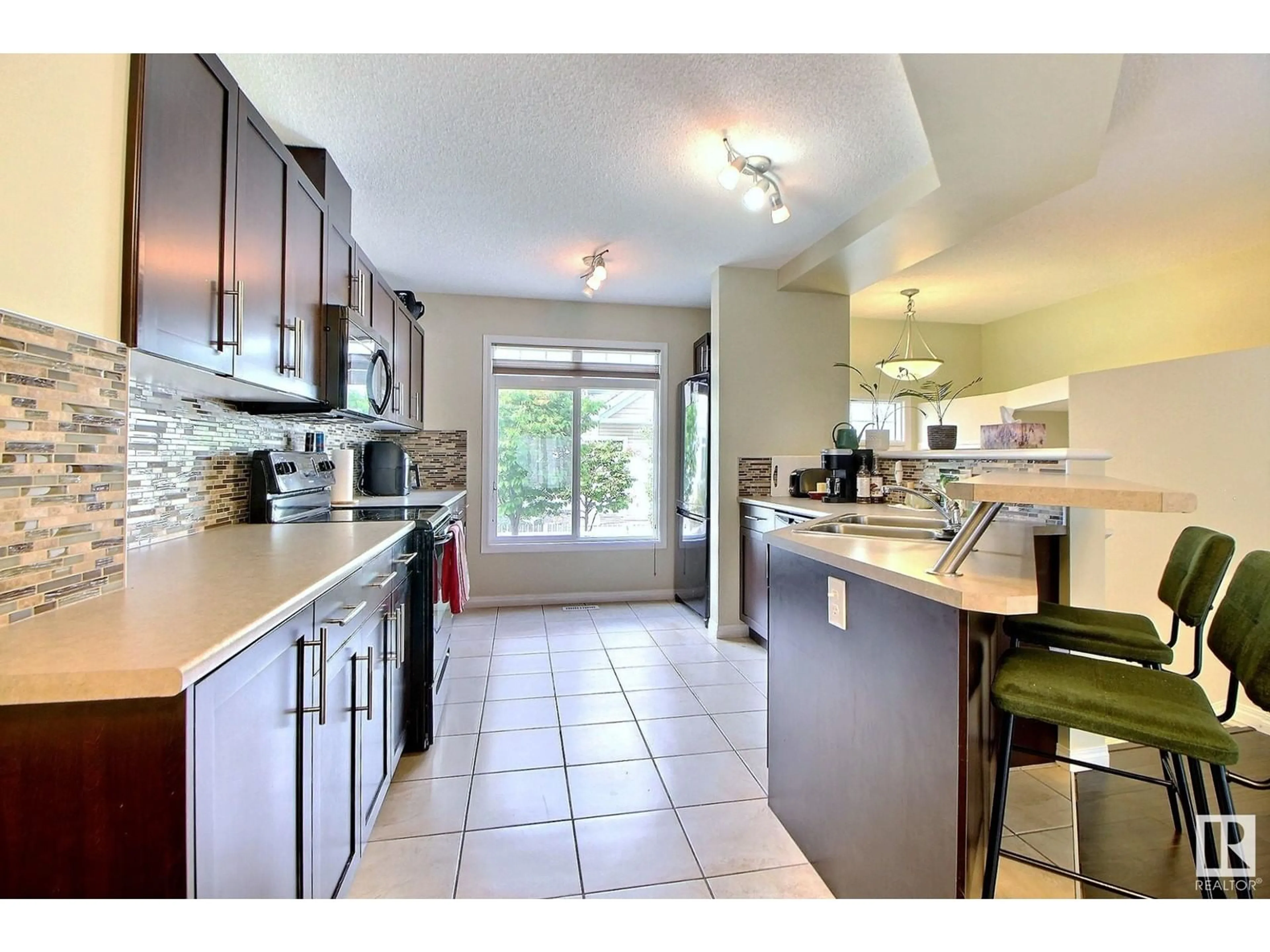Open concept kitchen, ceramic/tile floor for #143 - 1804 70 ST, Edmonton Alberta T6X0H4