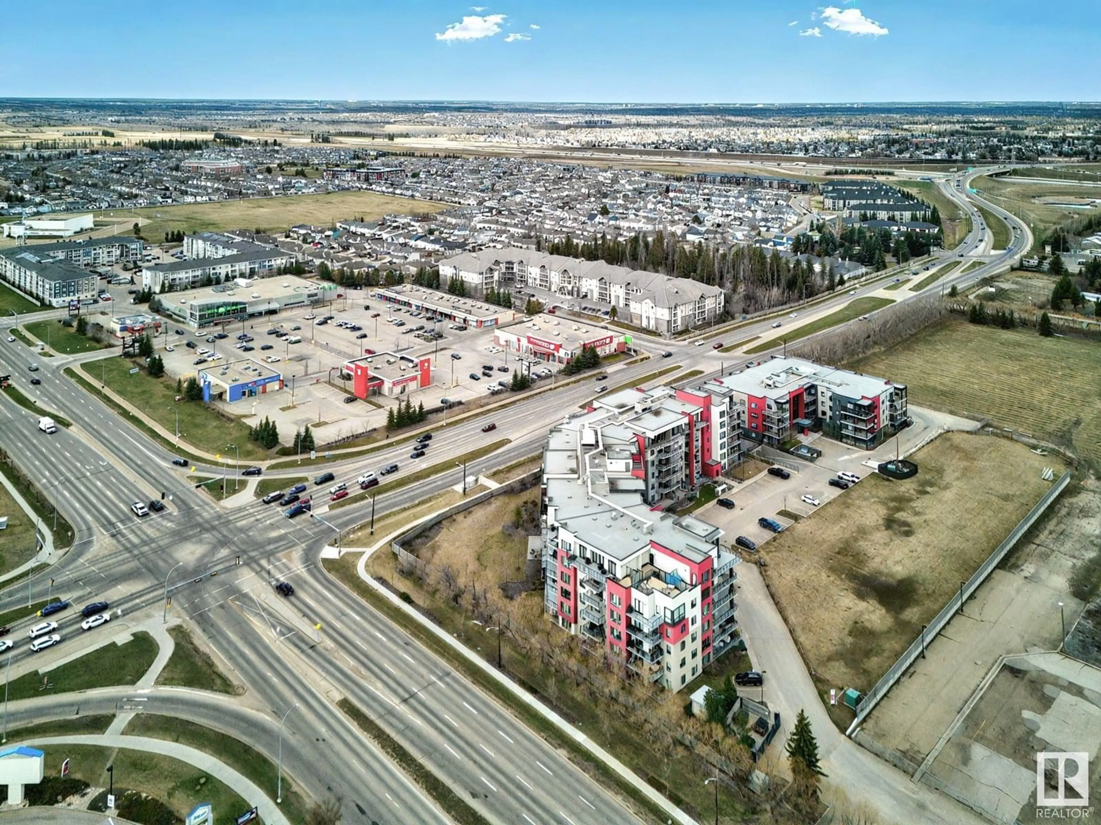 A pic from outside/outdoor area/front of a property/back of a property/a pic from drone, street for 11074 - 230 ELLERSLIE RD, Edmonton Alberta T6W2C2