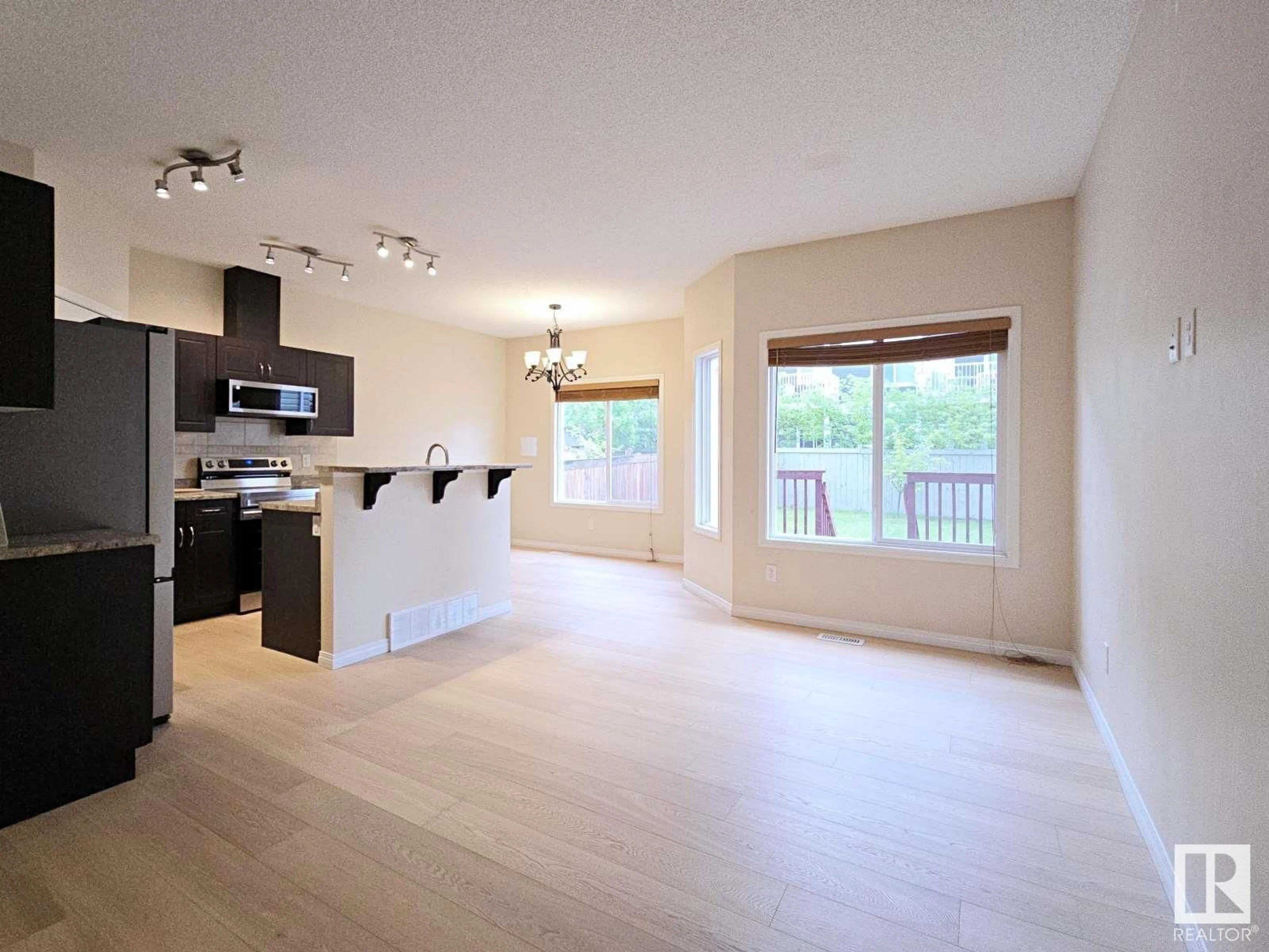 Open concept kitchen, wood/laminate floor for 1826 RUTHERFORD RD, Edmonton Alberta T6W0Z8