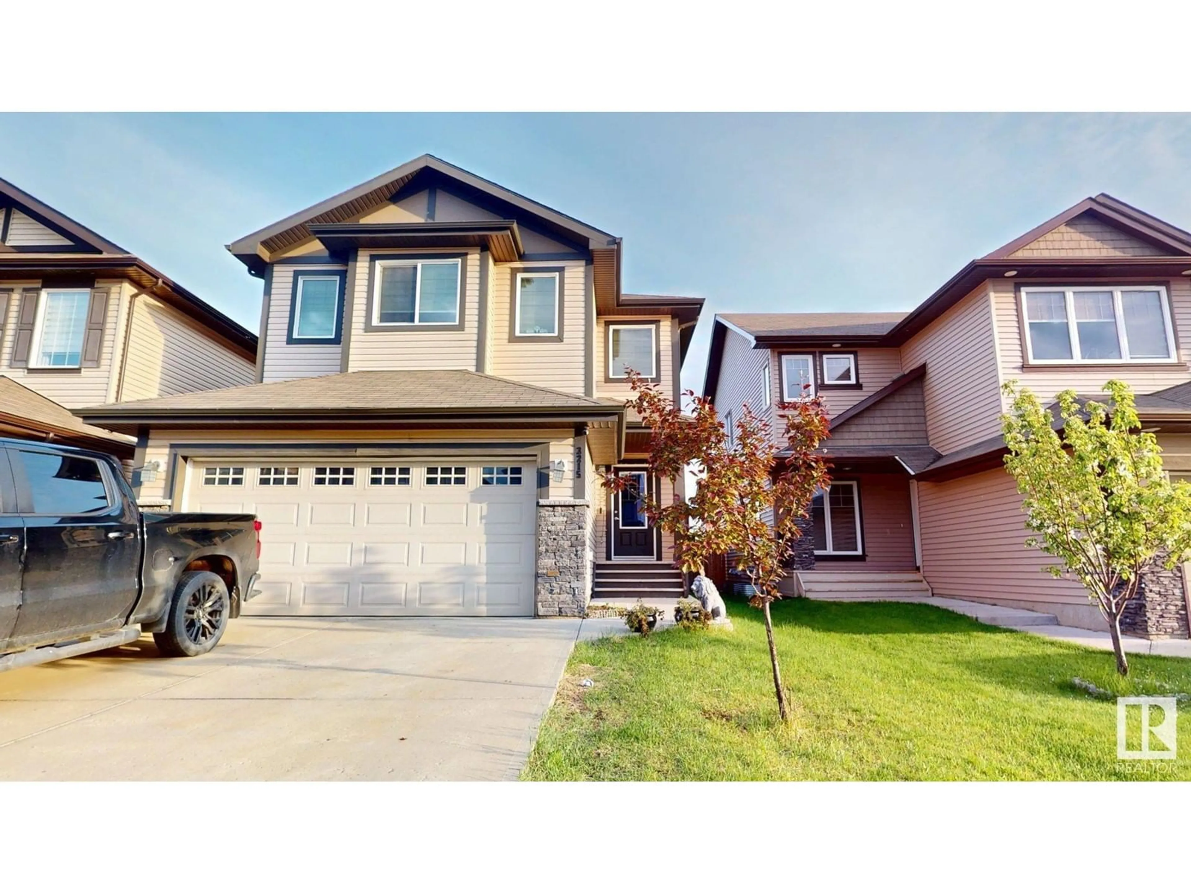 Home with vinyl exterior material, street for 3215 15 AV, Edmonton Alberta T6T0V2