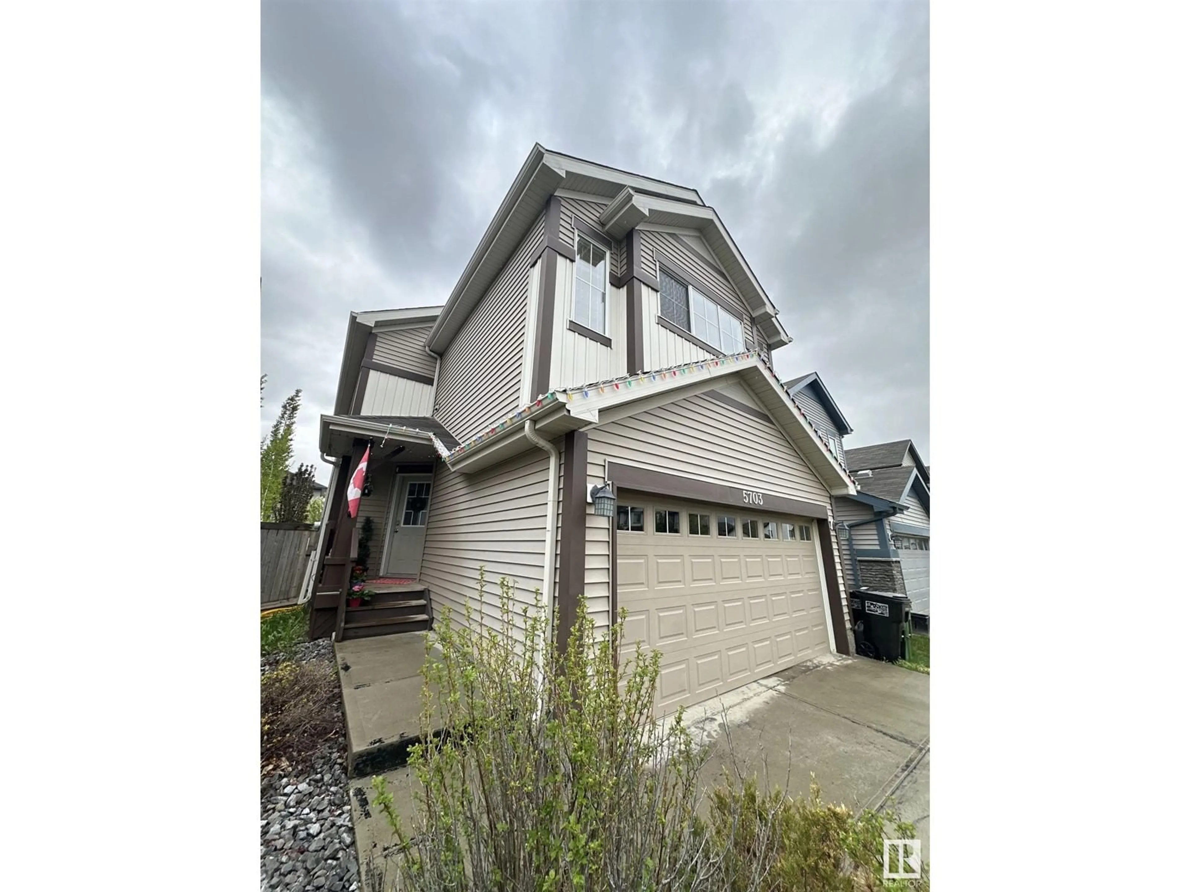 Home with vinyl exterior material, street for 5703 18 AV, Edmonton Alberta T6X1P6