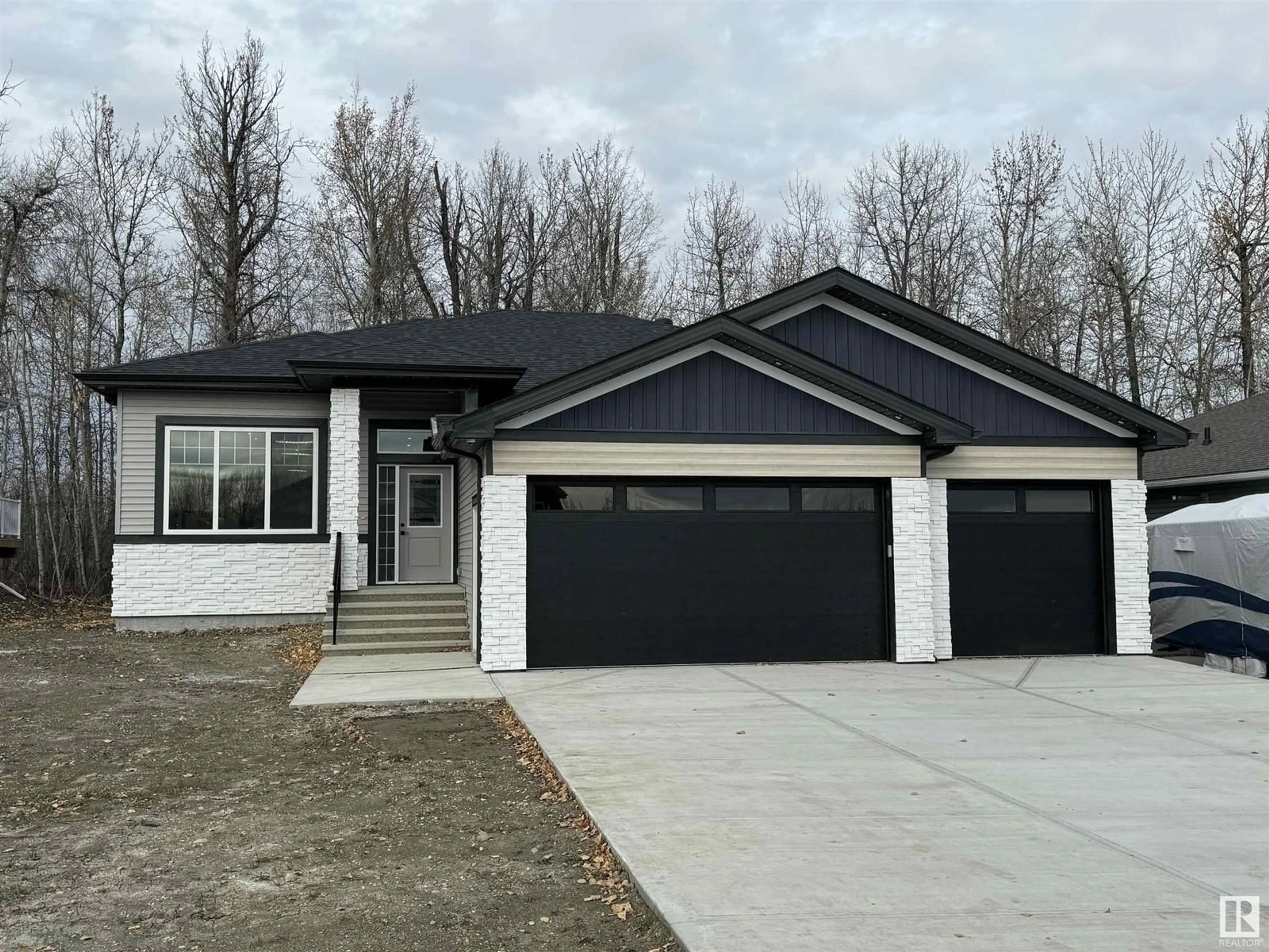 Home with vinyl exterior material, street for 73 - 506 49119 RR, Rural Brazeau County Alberta T7A0B9
