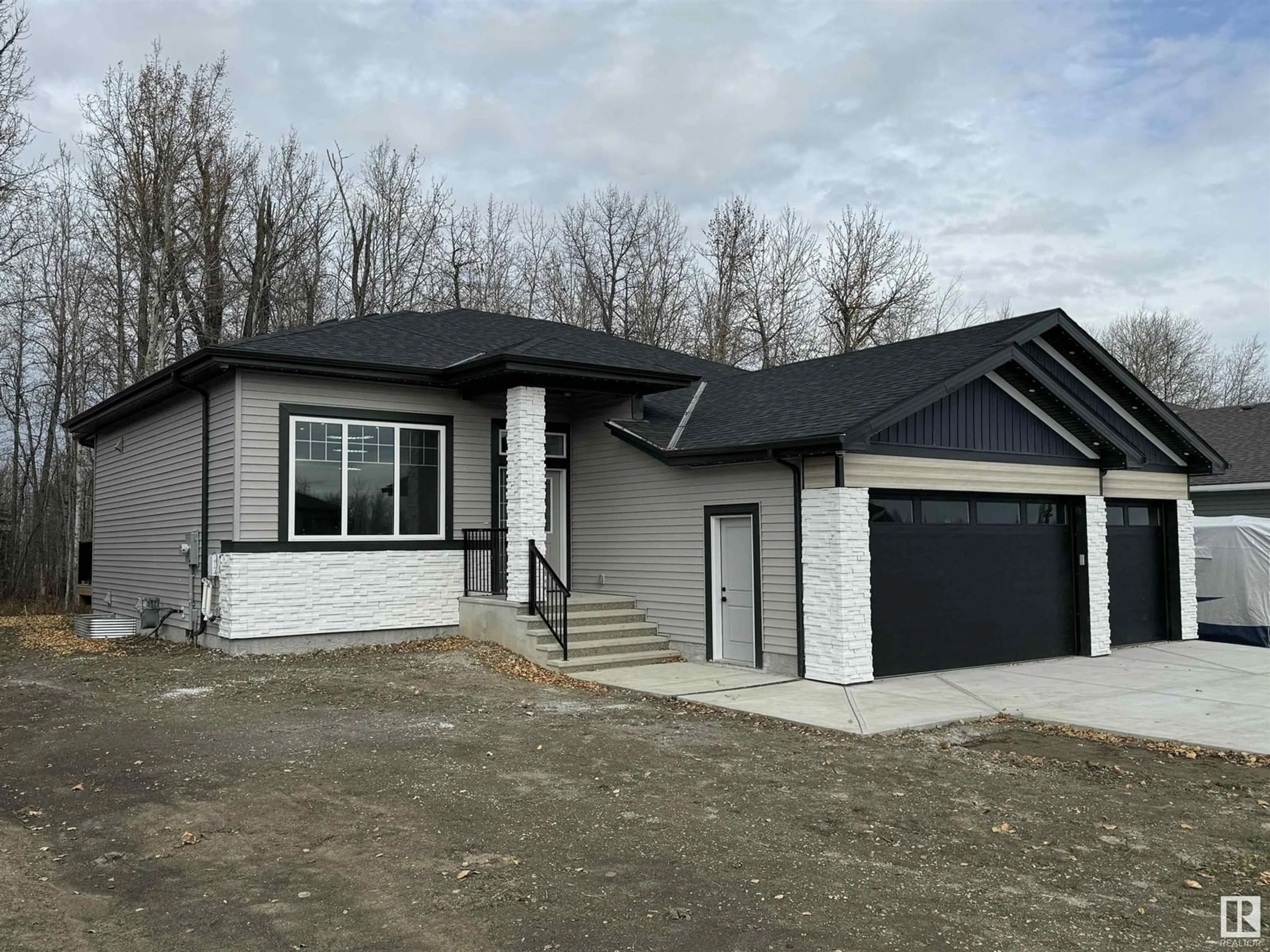 Home with vinyl exterior material, street for 73 - 506 49119 RR, Rural Brazeau County Alberta T7A0B9