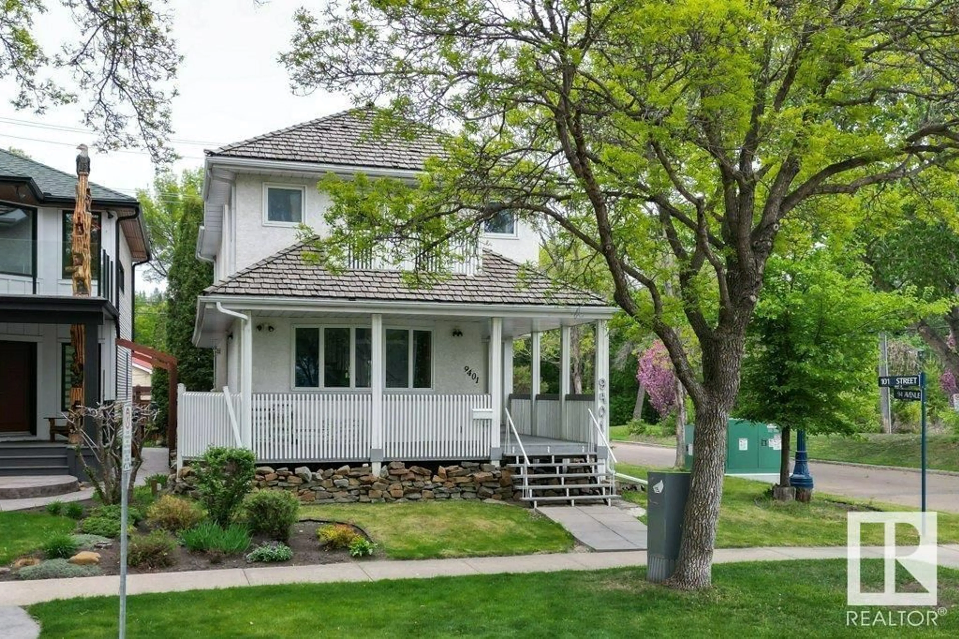 Home with vinyl exterior material, street for NW - 9401 101 ST, Edmonton Alberta T5K0W5