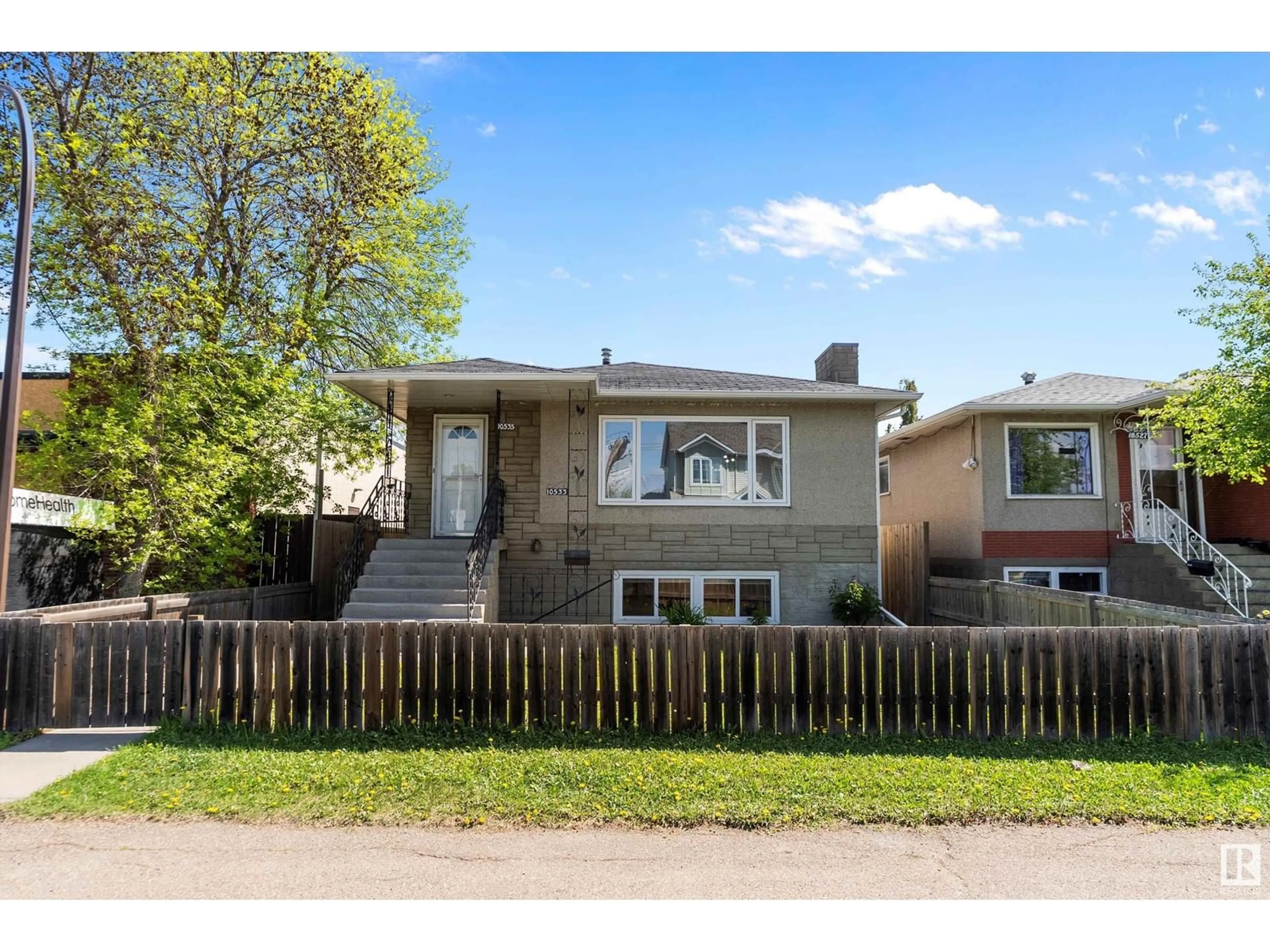 Home with vinyl exterior material, street for NW - 10533 / 10535 79 ST, Edmonton Alberta T6A3H2