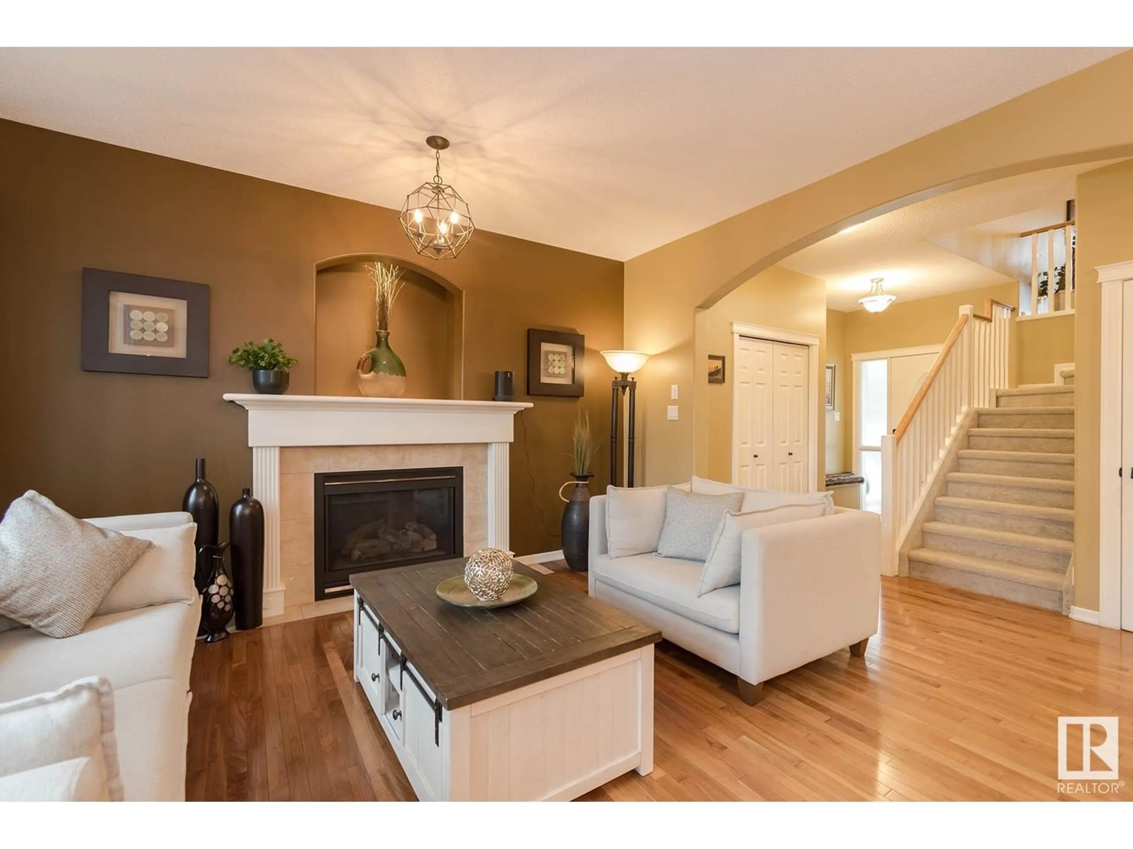 Living room with furniture, wood/laminate floor for 20435 56 AV, Edmonton Alberta T6M0B8