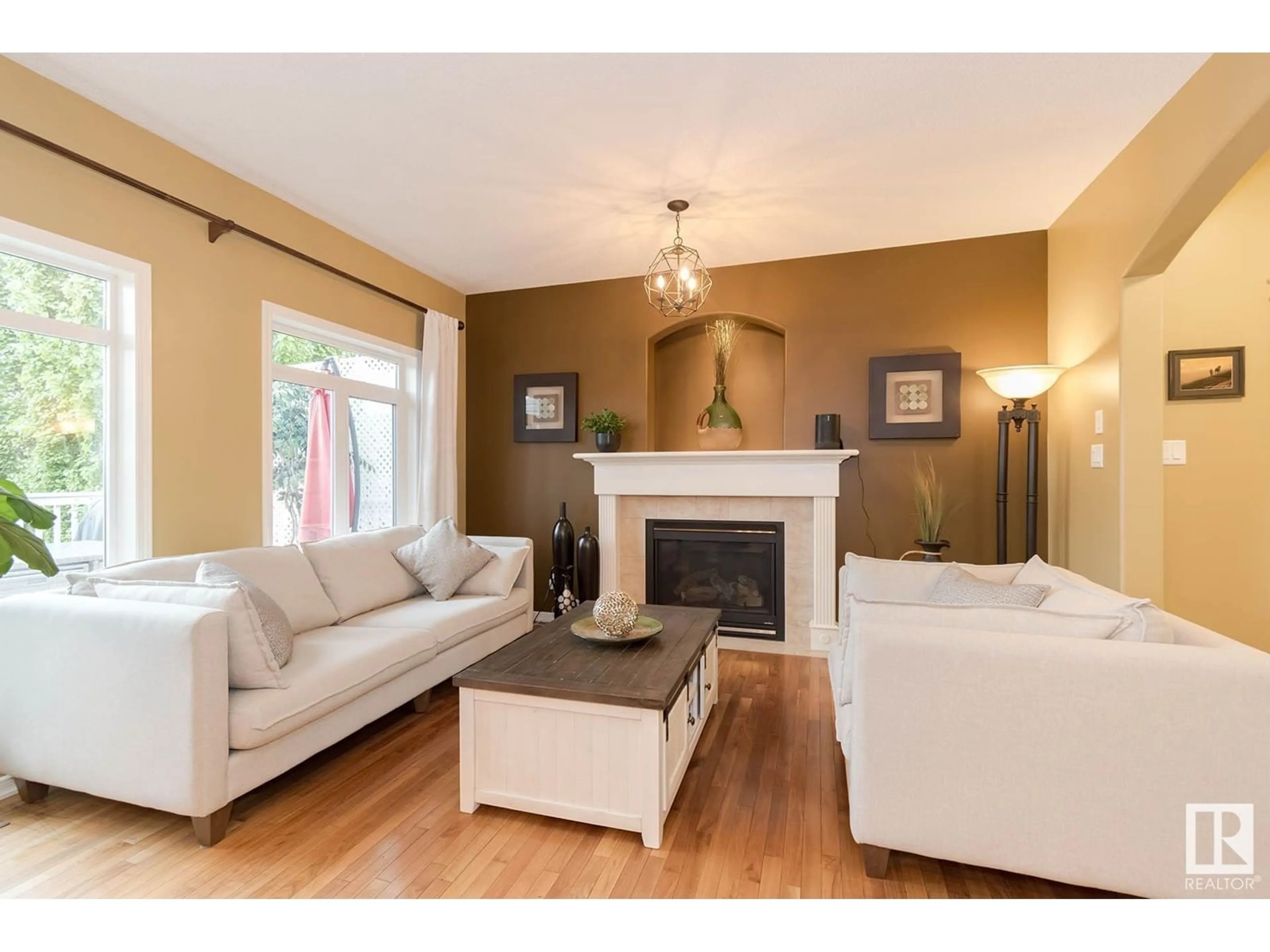 Living room with furniture, wood/laminate floor for 20435 56 AV, Edmonton Alberta T6M0B8