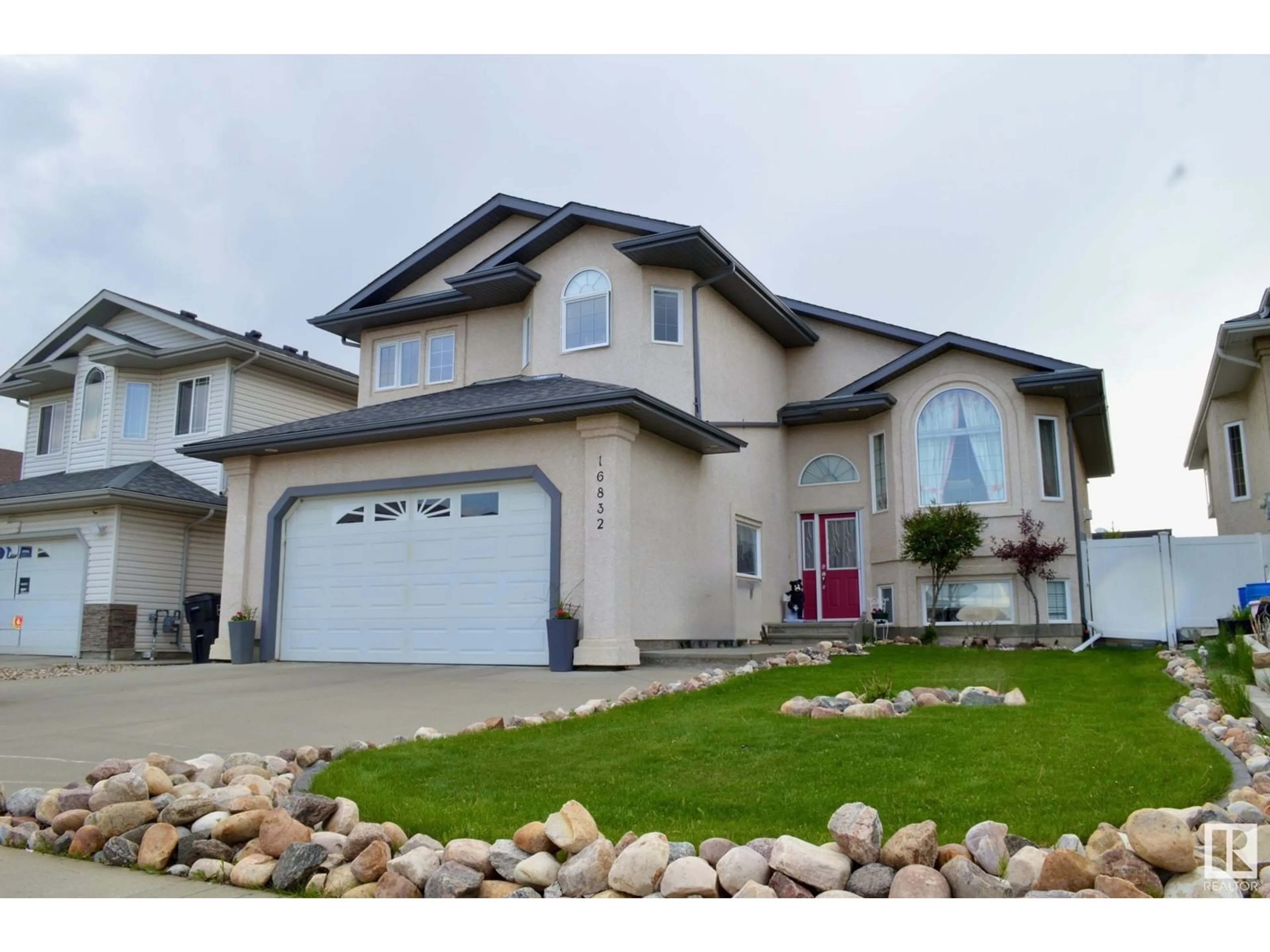 Home with vinyl exterior material, street for 16832 79 ST, Edmonton Alberta T5Z3Y9