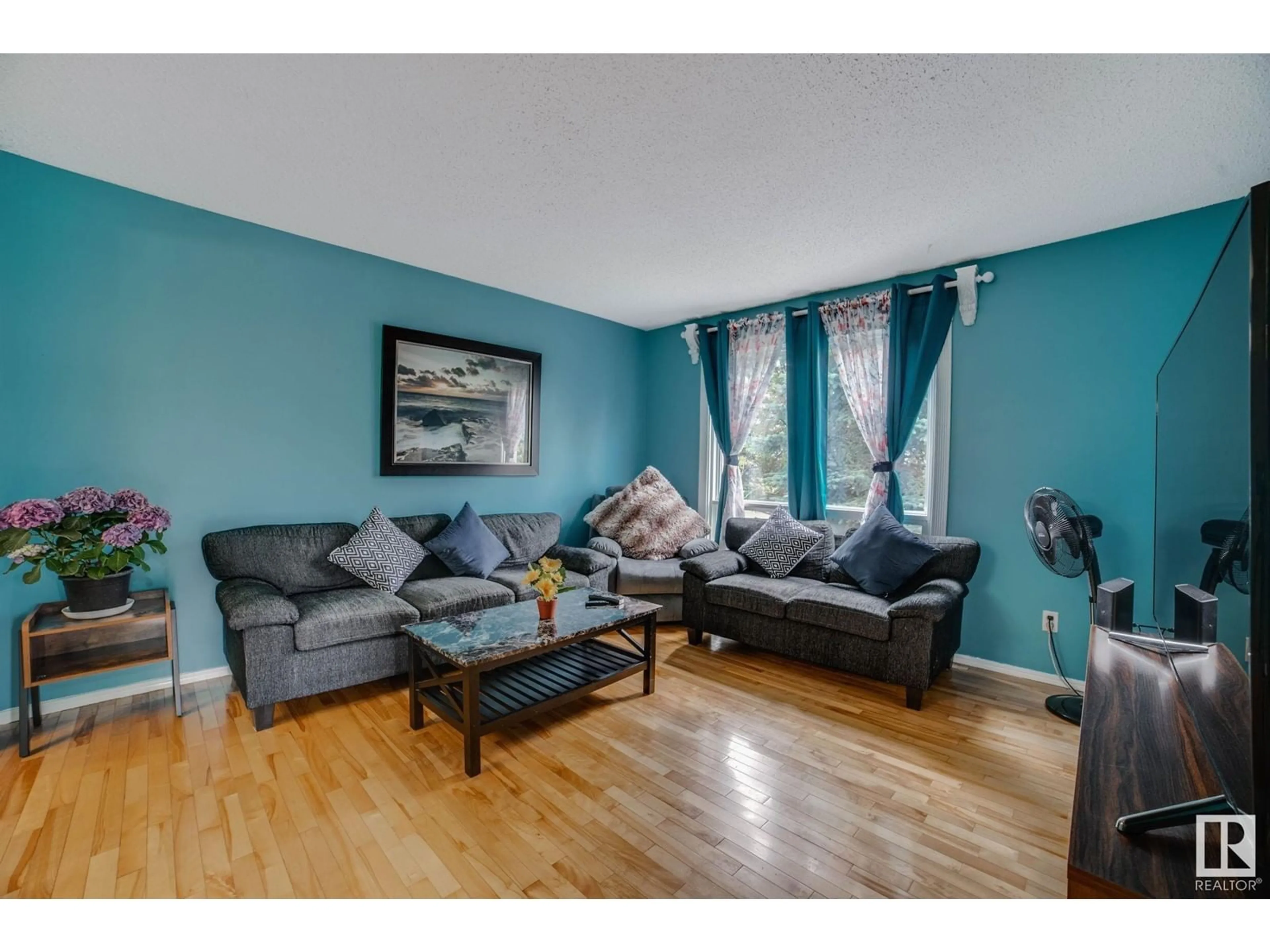 Living room with furniture, wood/laminate floor for 827 ERIN PL, Edmonton Alberta T5T1M6