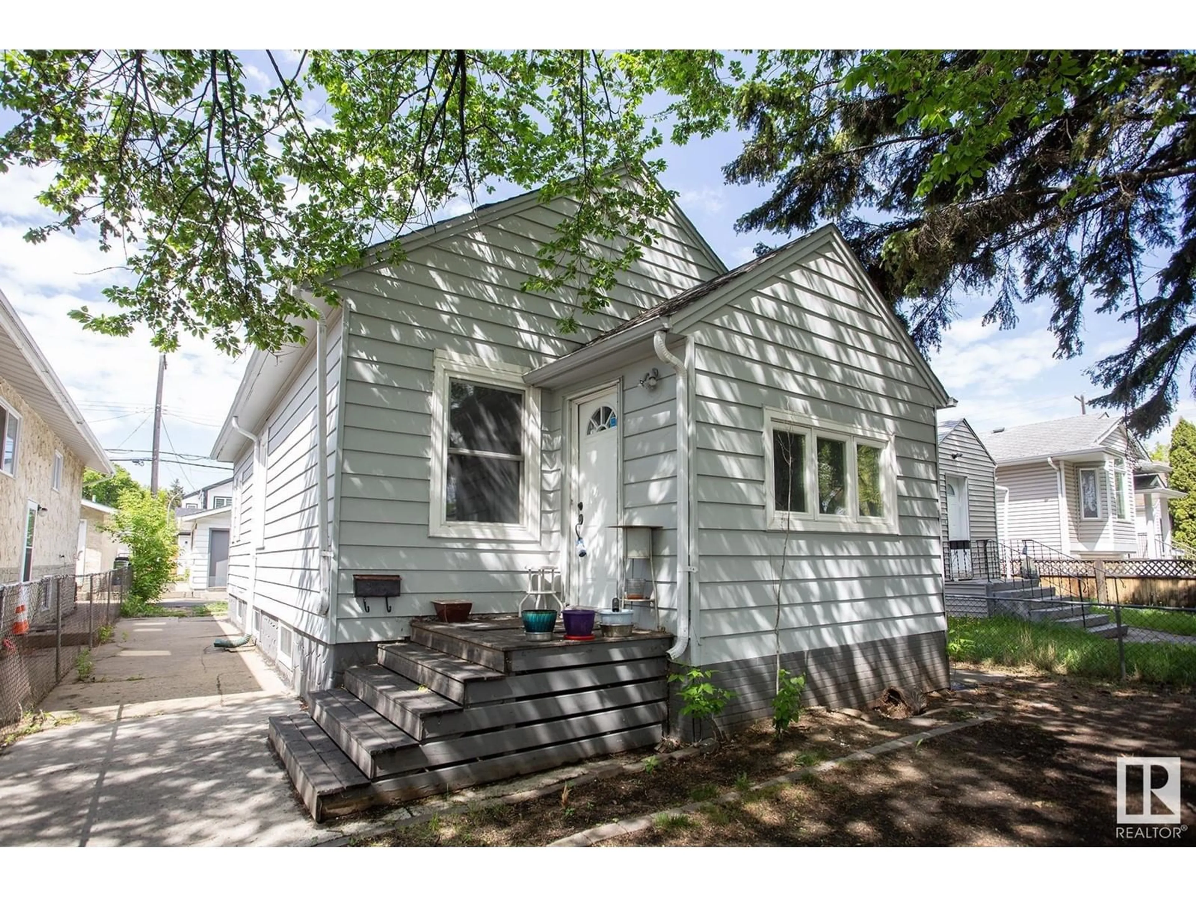Home with vinyl exterior material, street for 11536 83 ST, Edmonton Alberta T5B2Y5